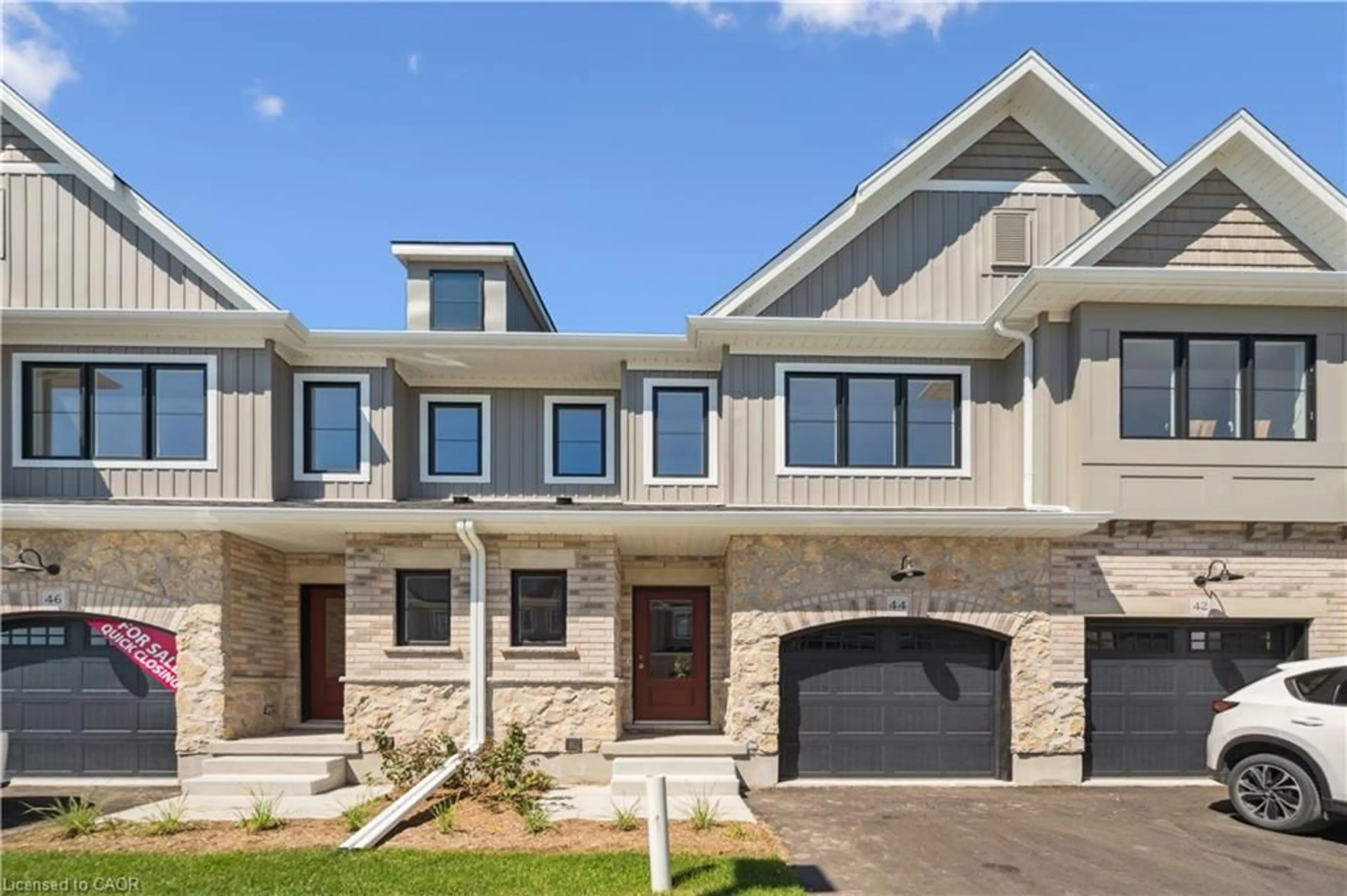 Home with brick exterior material, street for 44 Fieldstone Lane, Wellington Ontario N0B 1S0