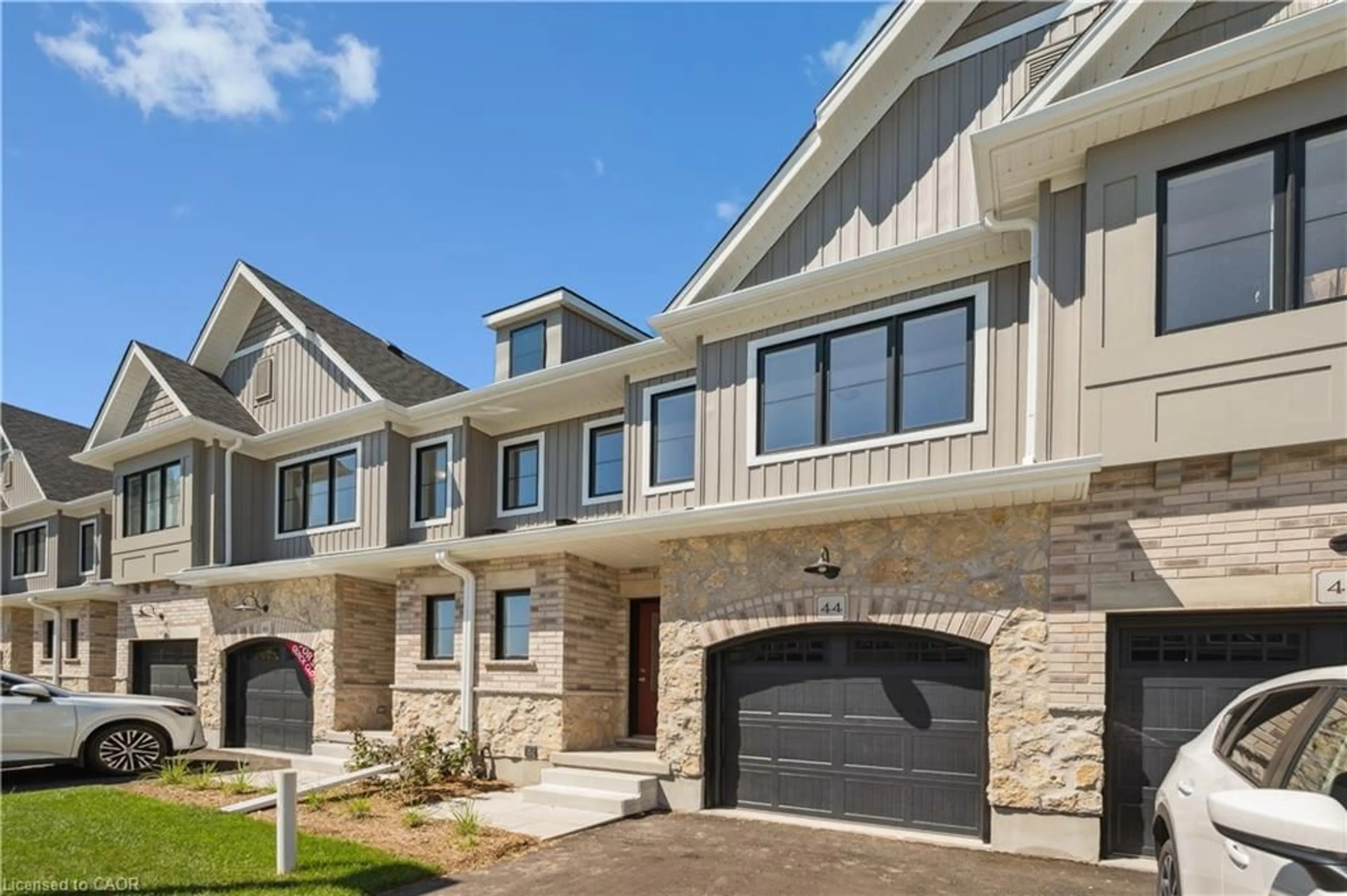 Home with brick exterior material, street for 44 Fieldstone Lane, Wellington Ontario N0B 1S0