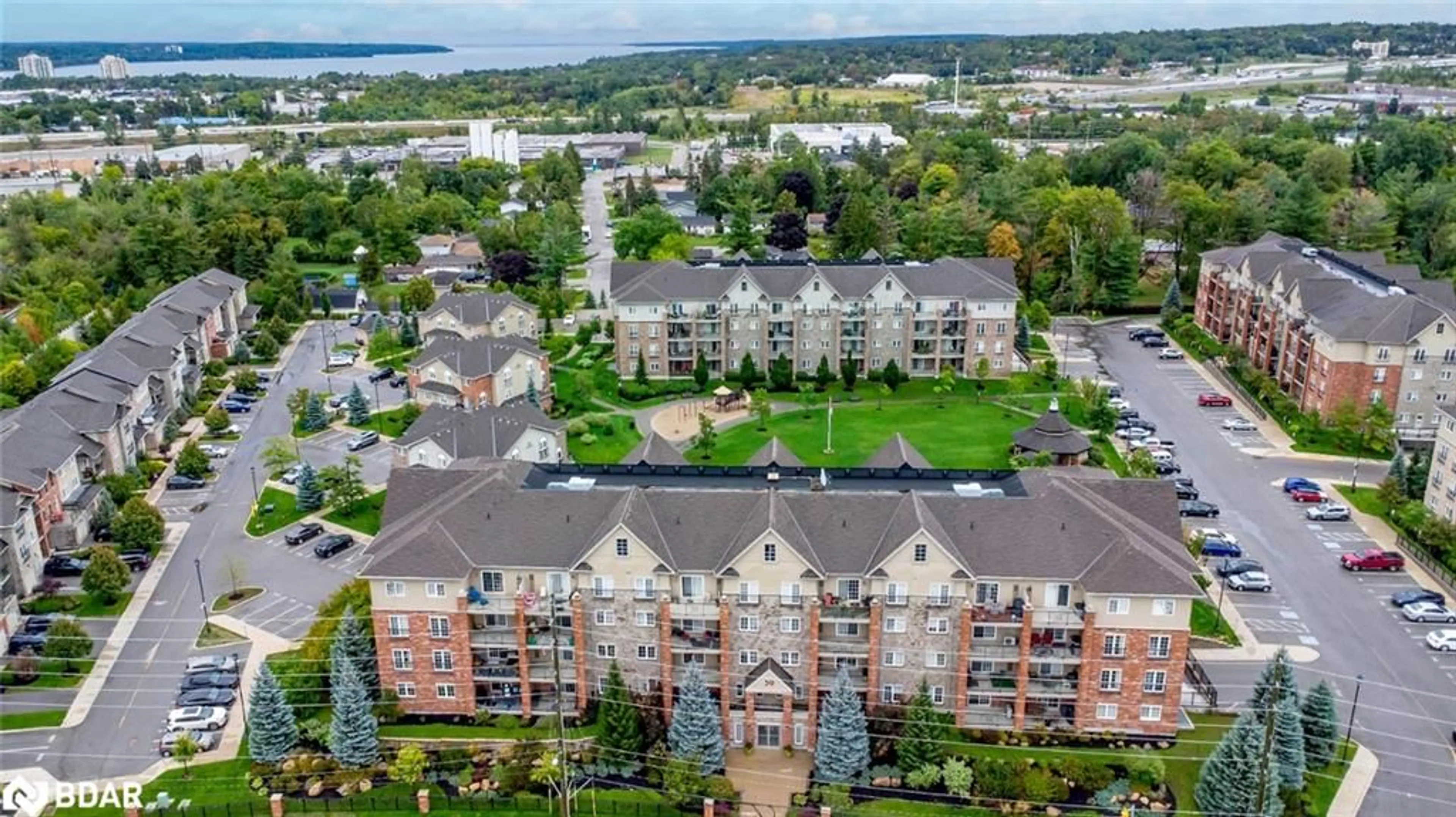 A pic from outside/outdoor area/front of a property/back of a property/a pic from drone, city buildings view from balcony for 39 Ferndale Dr #205, Barrie Ontario L4N 5T5