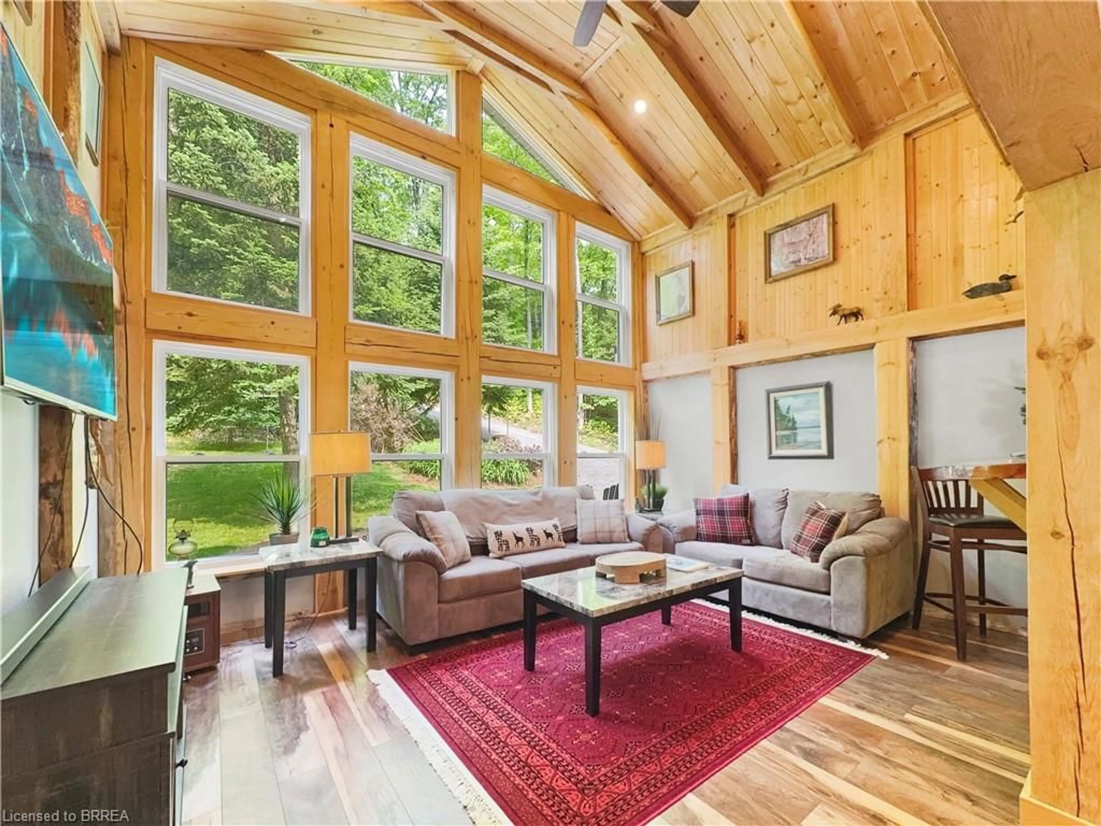 Living room with furniture, wood/laminate floor for 31 Fowke Lake Rd, South River Ontario P0A 1X0