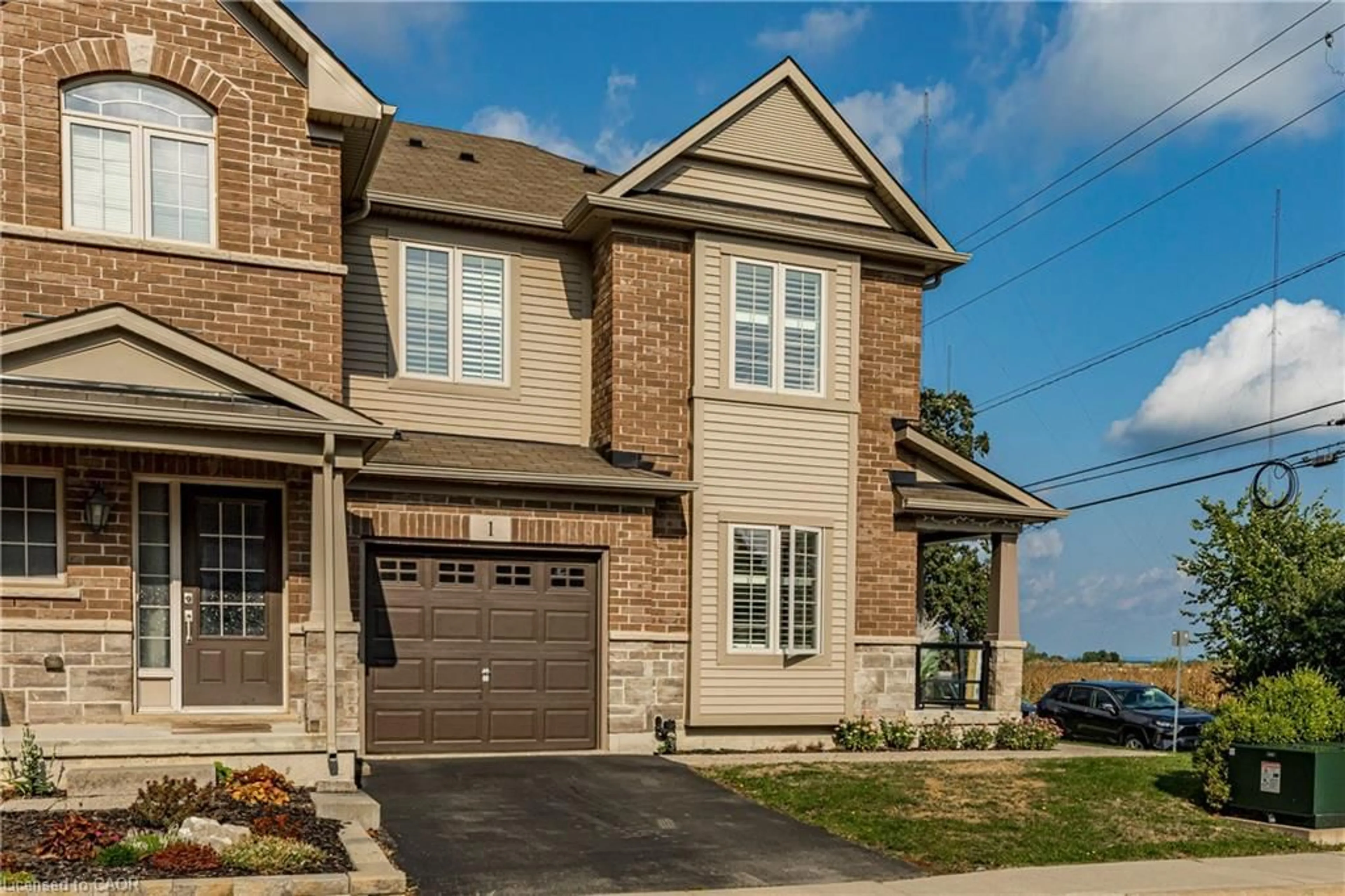 Home with brick exterior material, street for 515 Winston Rd #1, Grimsby Ontario L3M 0C8
