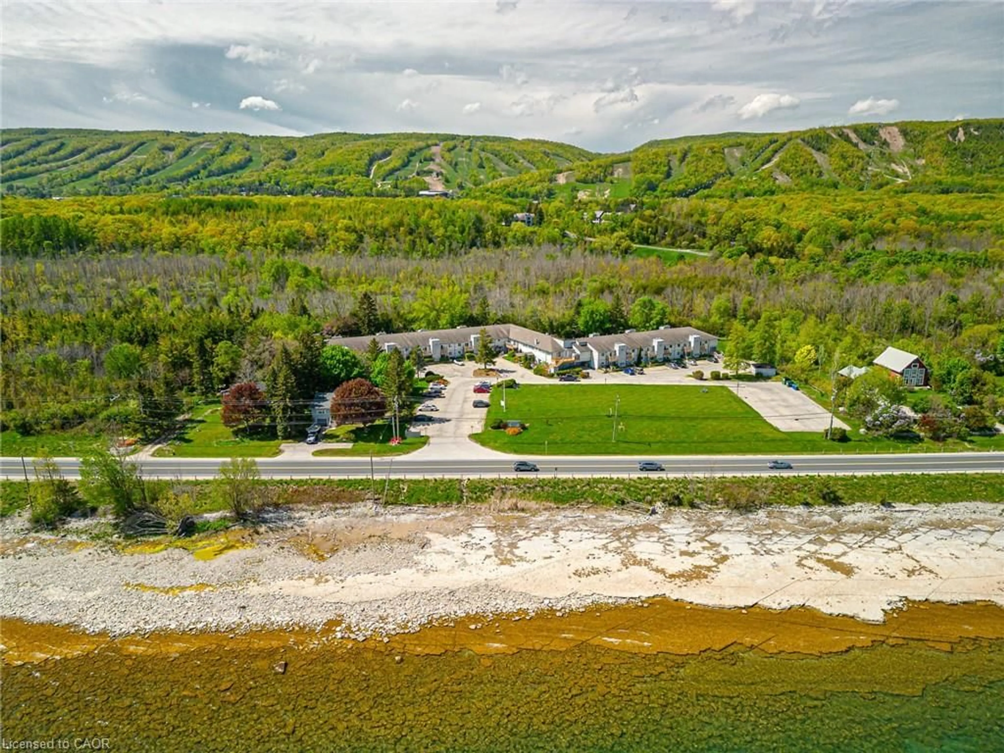 A pic from outside/outdoor area/front of a property/back of a property/a pic from drone, water/lake/river/ocean view for 209472 26 Hwy #19, The Blue Mountains Ontario L9Y 0V3