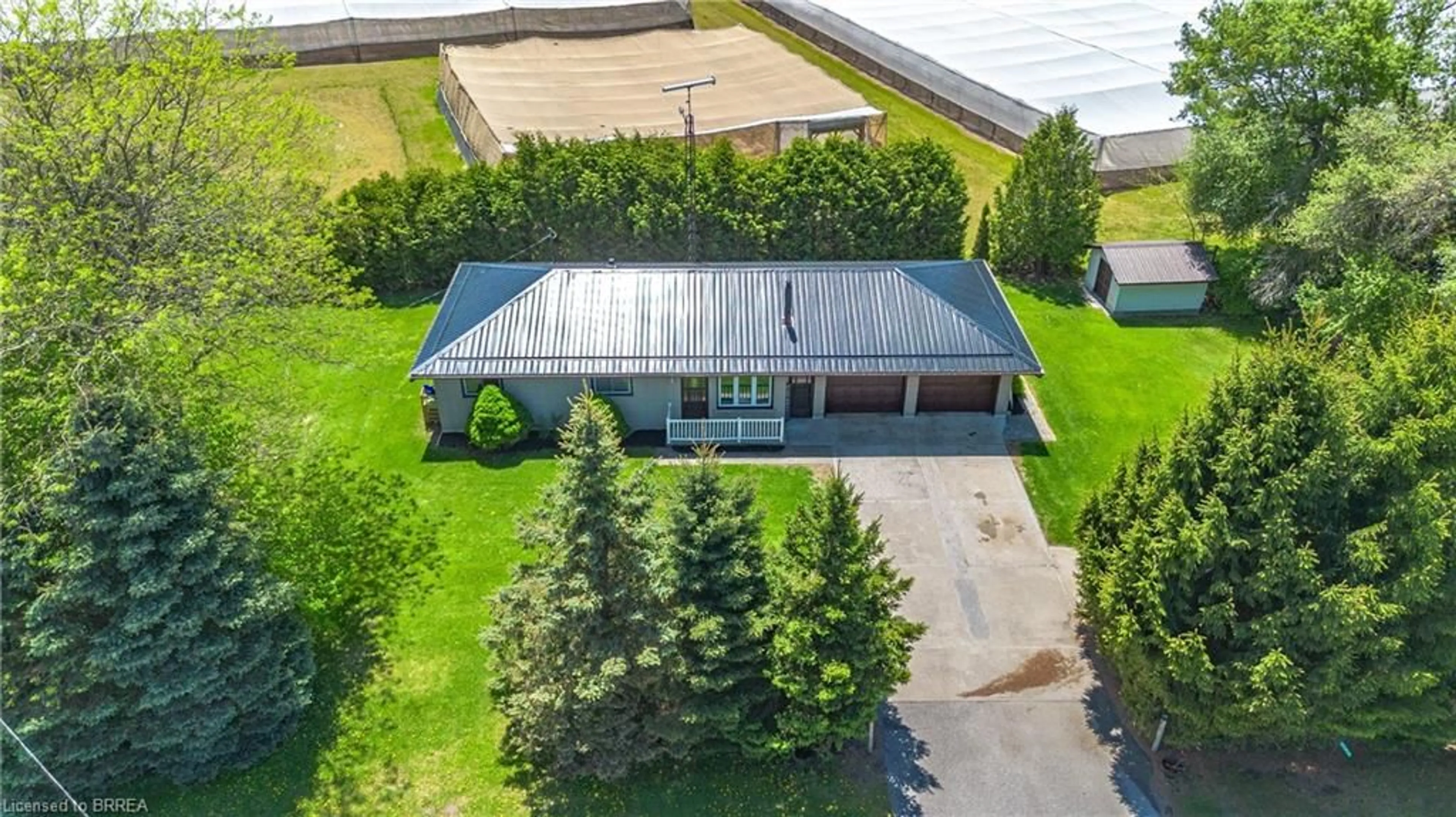A pic from outside/outdoor area/front of a property/back of a property/a pic from drone, building for 2066 #3 Hwy, Delhi Ontario N4B 2W4