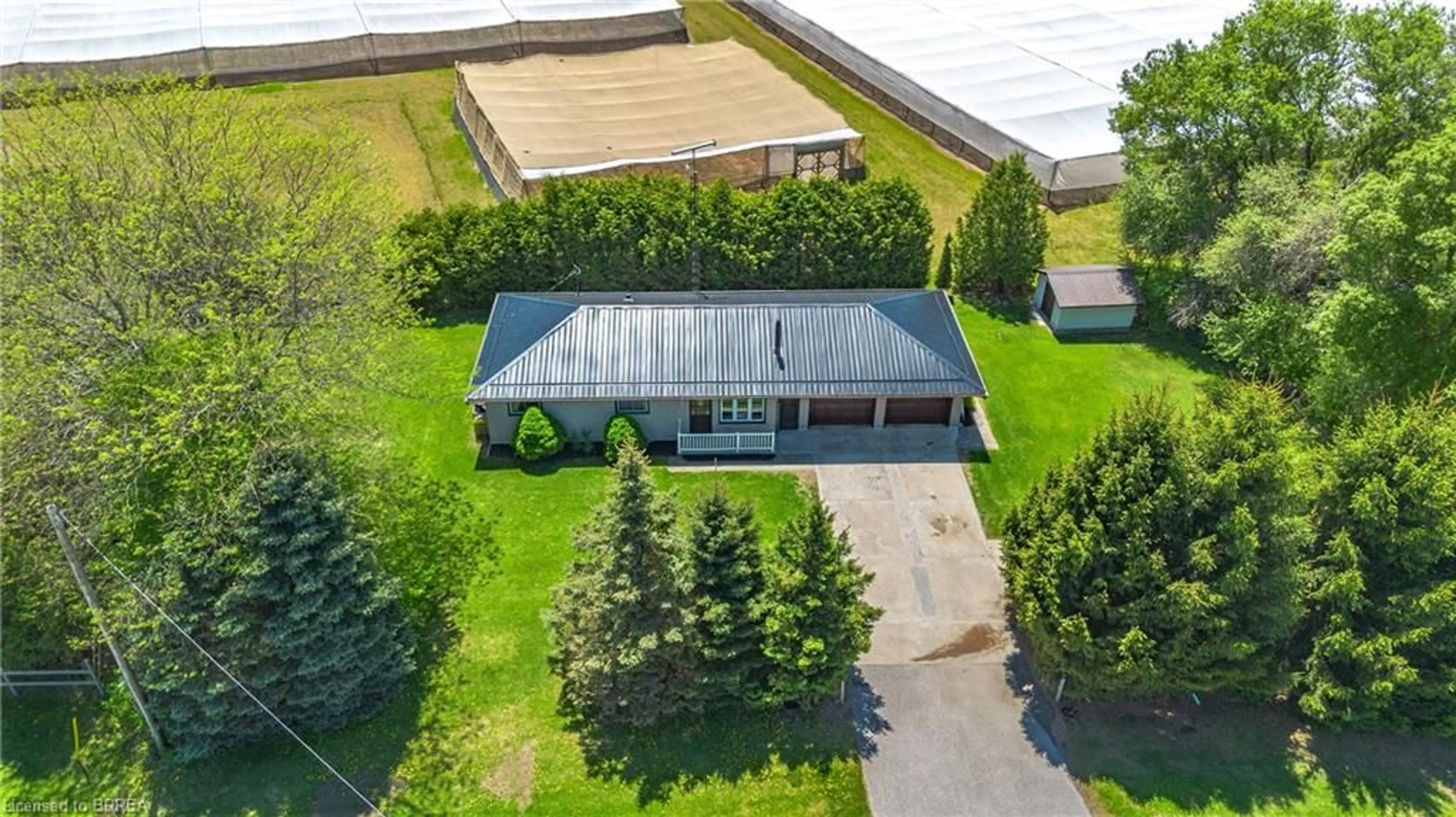 A pic from outside/outdoor area/front of a property/back of a property/a pic from drone, water/lake/river/ocean view for 2066 #3 Hwy, Delhi Ontario N4B 2W4