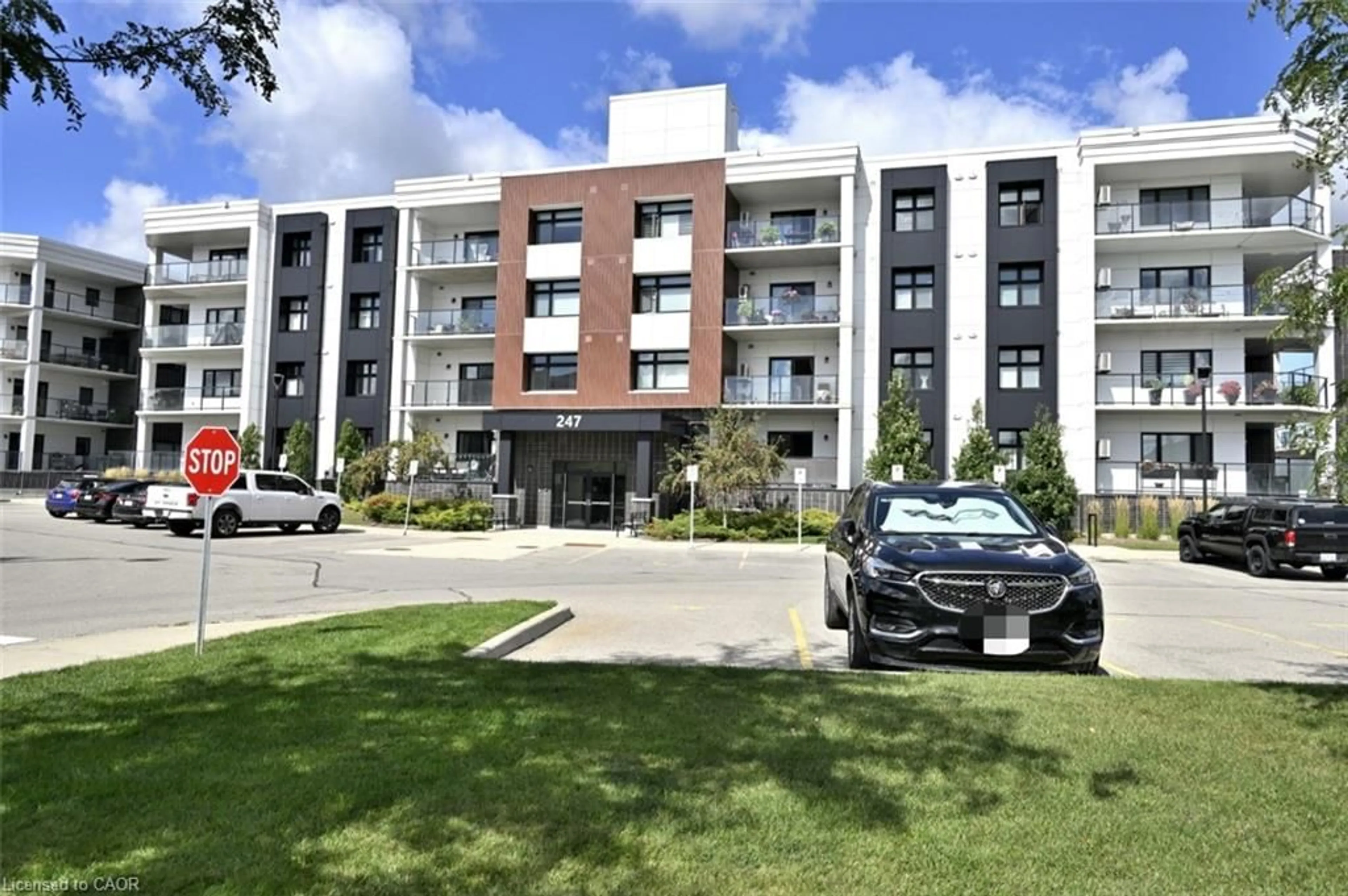 A pic from outside/outdoor area/front of a property/back of a property/a pic from drone, unknown for 247 Grey Silo Rd #201, Waterloo Ontario N2K 0G6