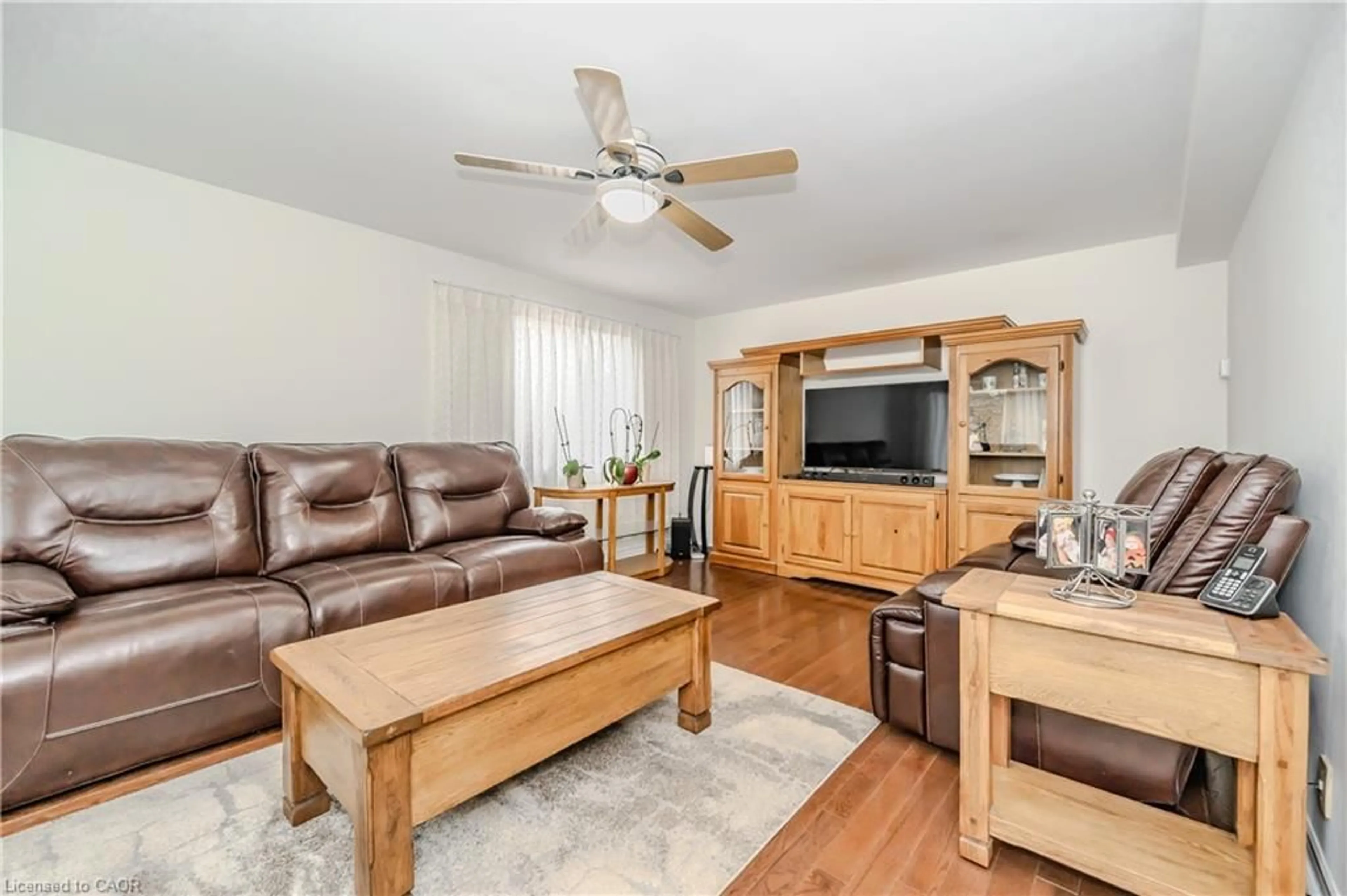 Living room with furniture, wood/laminate floor for 241 Elmira Rd S Rd, Guelph Ontario N1K 1R1