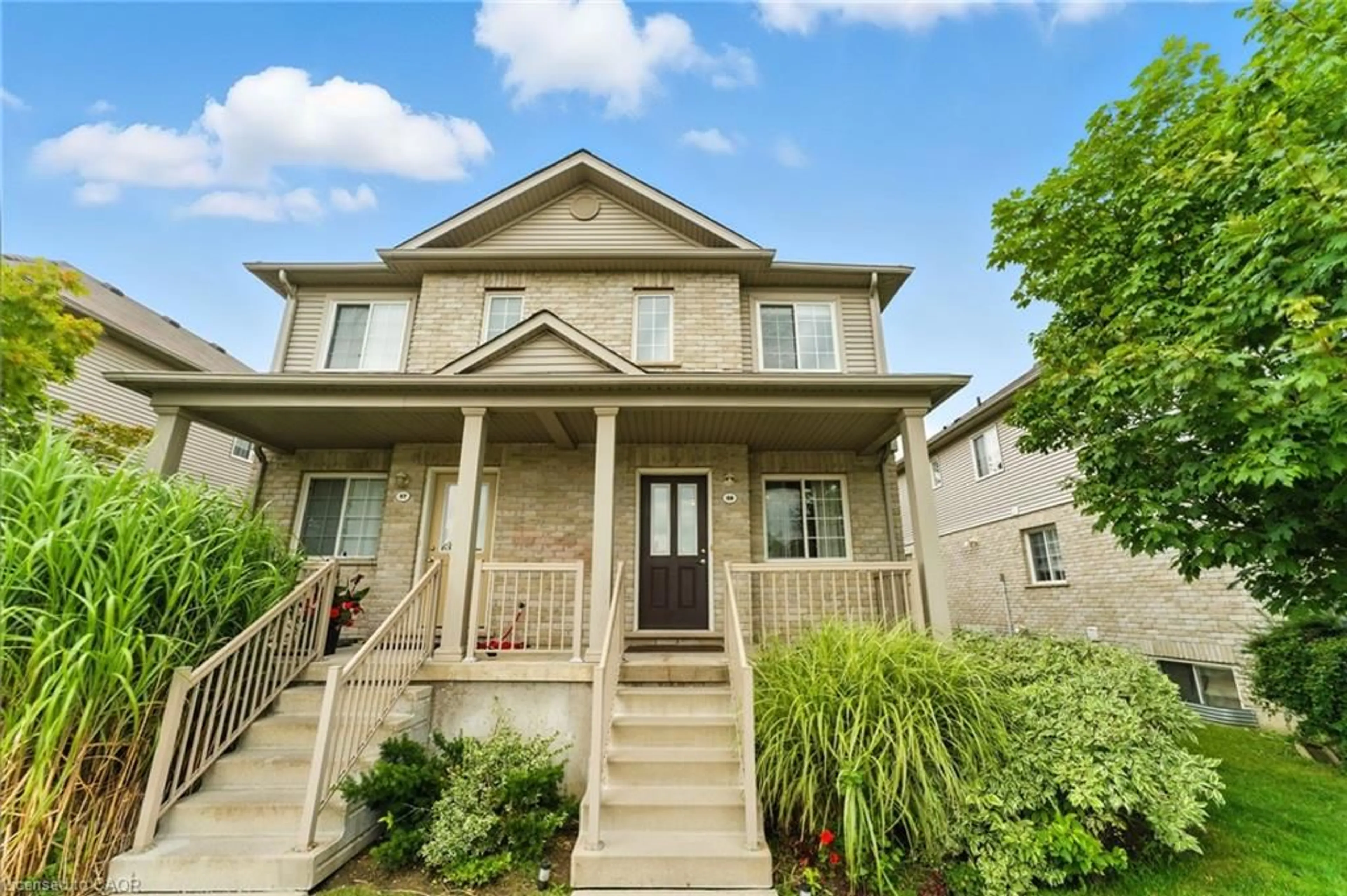 Home with vinyl exterior material, street for 35 Mountford Dr #59, Guelph Ontario N1E 0G6