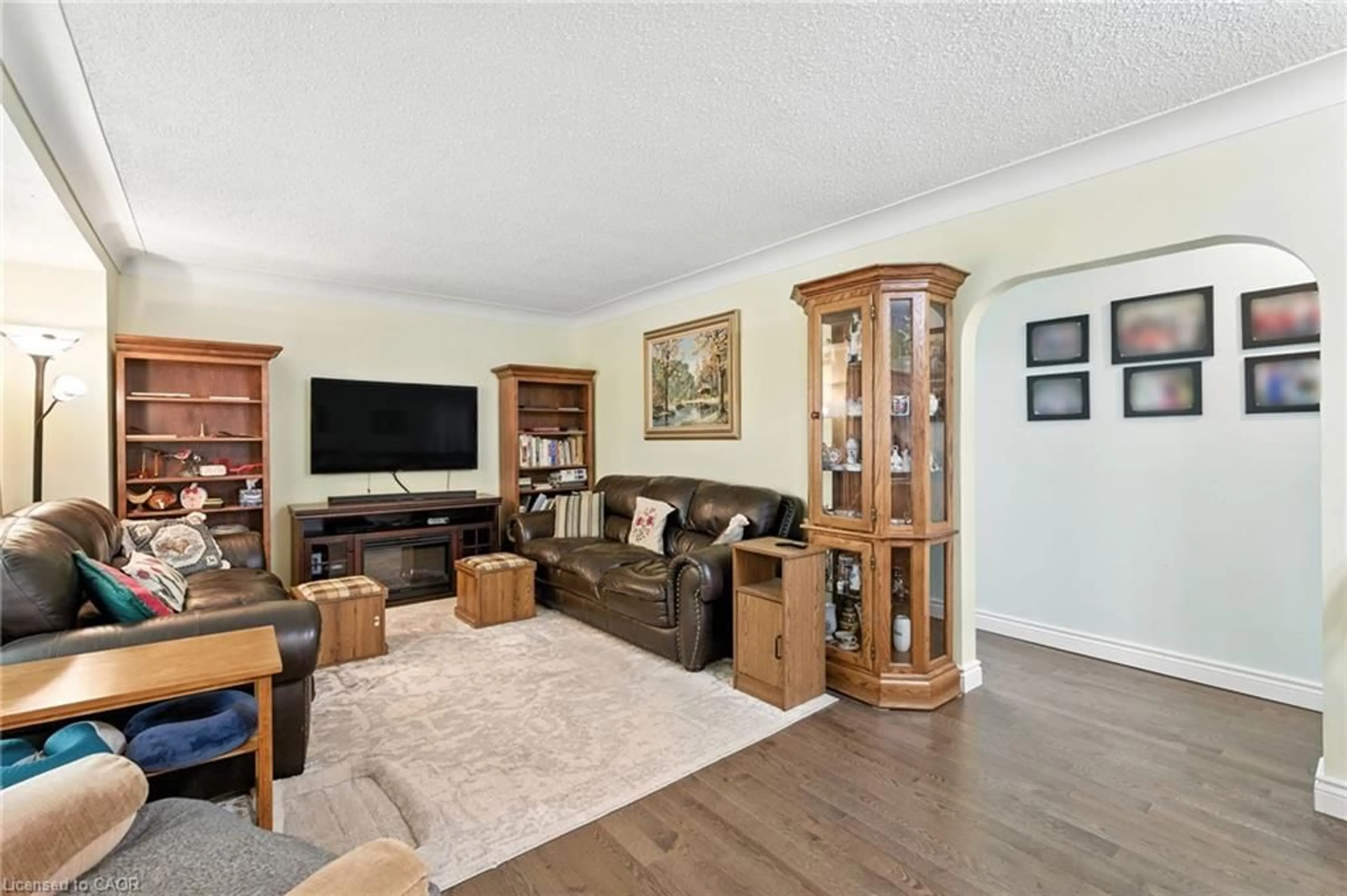 Living room with furniture, wood/laminate floor for 11 James Ave, Brantford Ontario N3S 6Y2