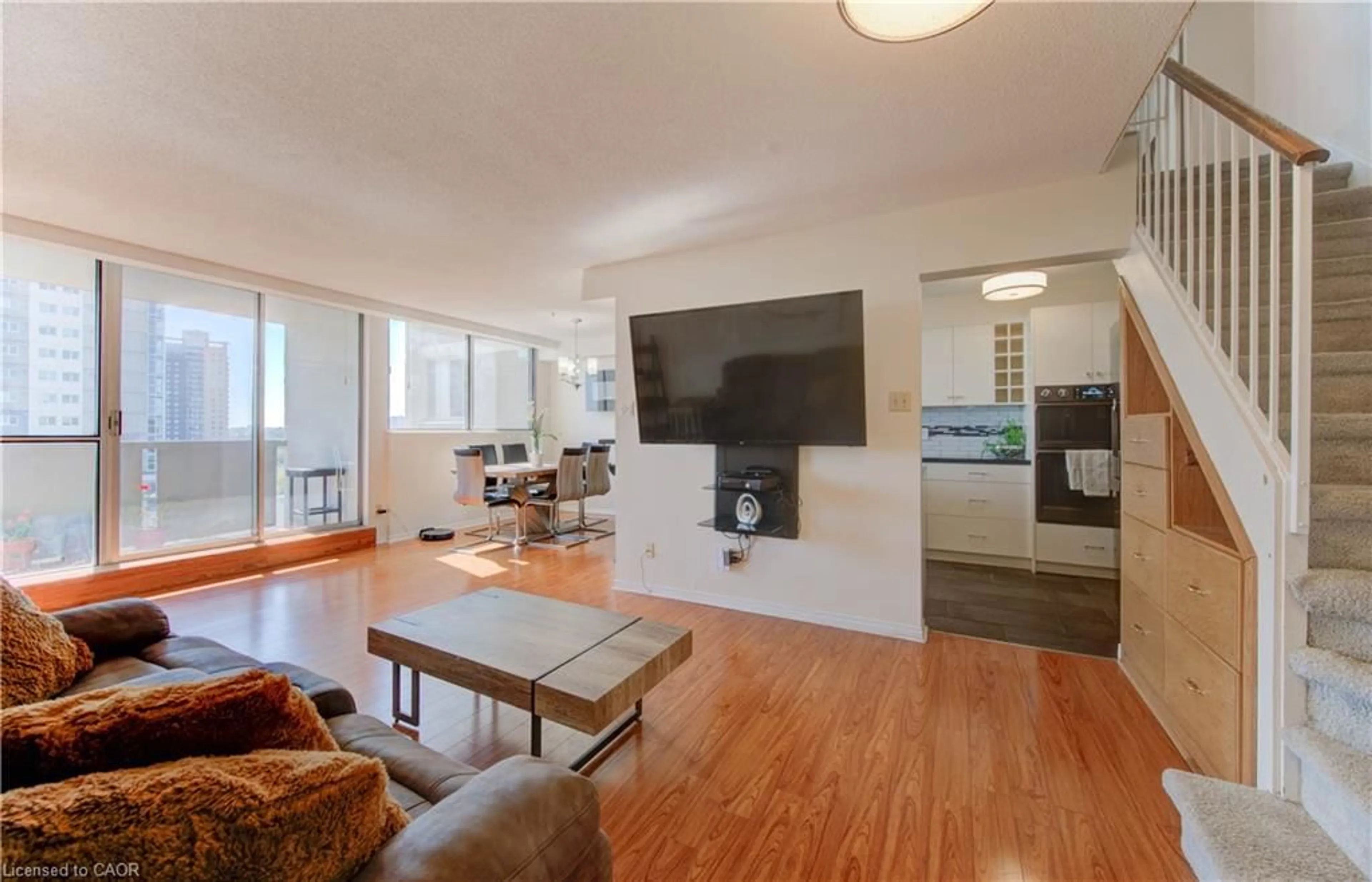 Living room with furniture, wood/laminate floor for 375 King St #504, Waterloo Ontario N2J 4L6