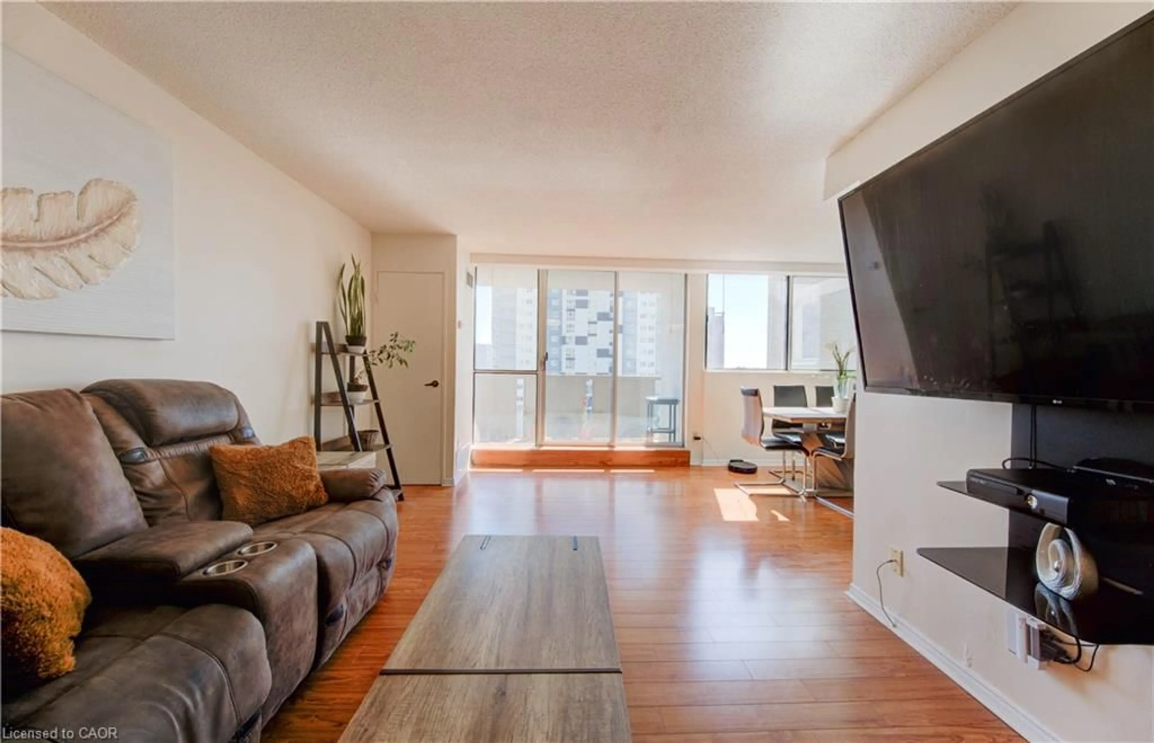 Living room with furniture, wood/laminate floor for 375 King St #504, Waterloo Ontario N2J 4L6