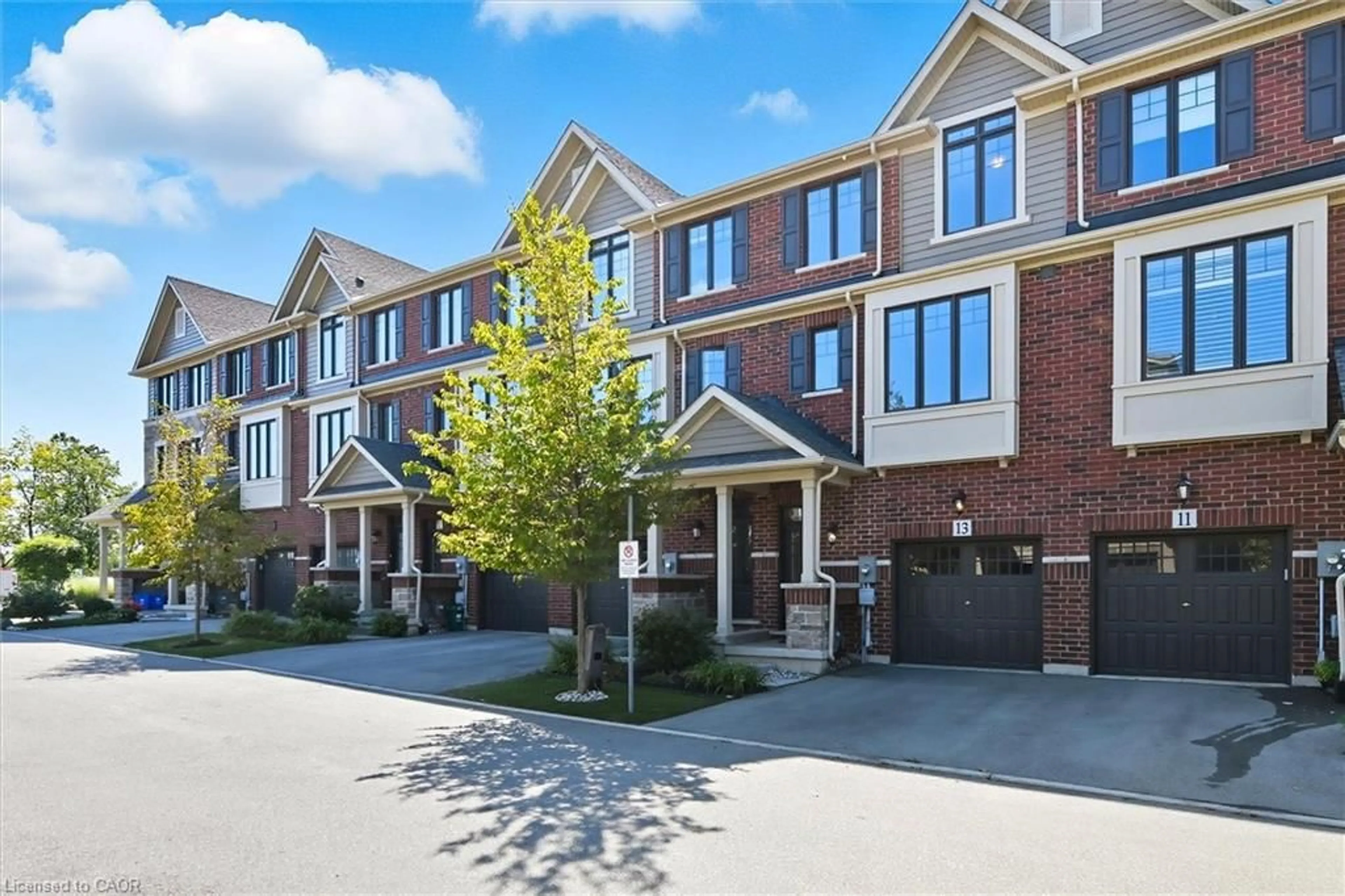 Home with brick exterior material, street for 13 Pierre Trudeau Lane, Grimsby Ontario L3M 0H3