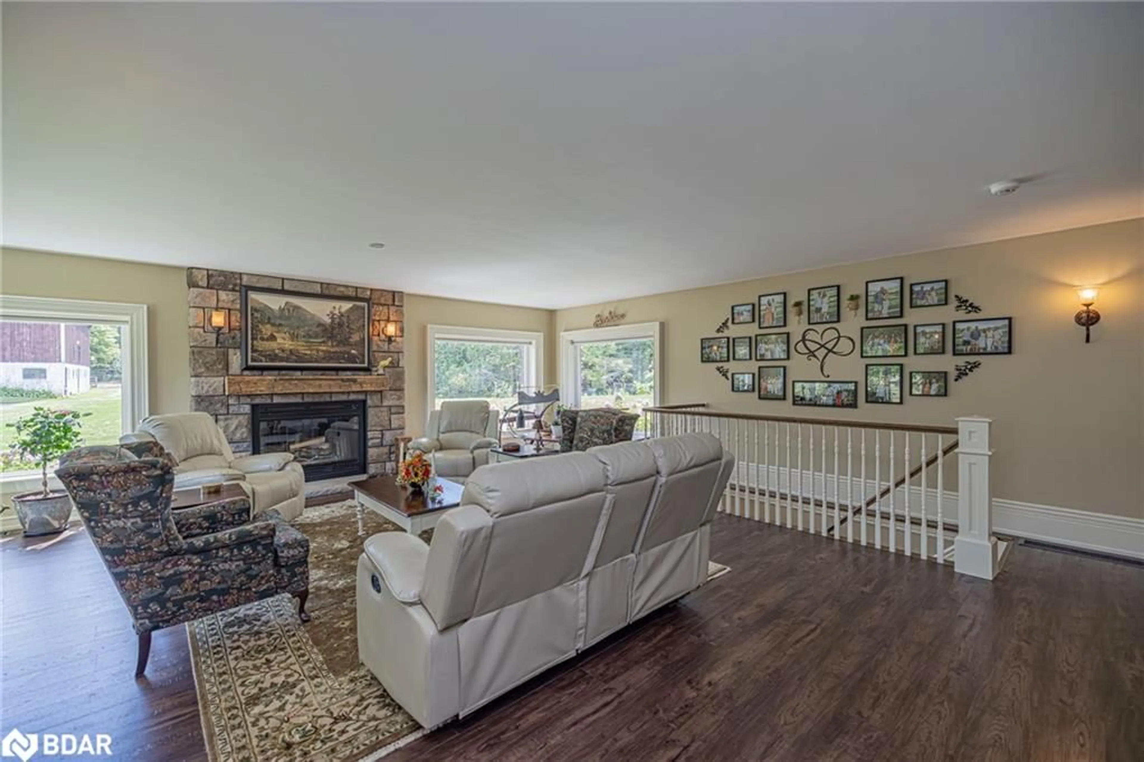 Living room with furniture, wood/laminate floor for 305 Bass Lake Sideroad East Side Road, Oro-Medonte Ontario L0L 2E0