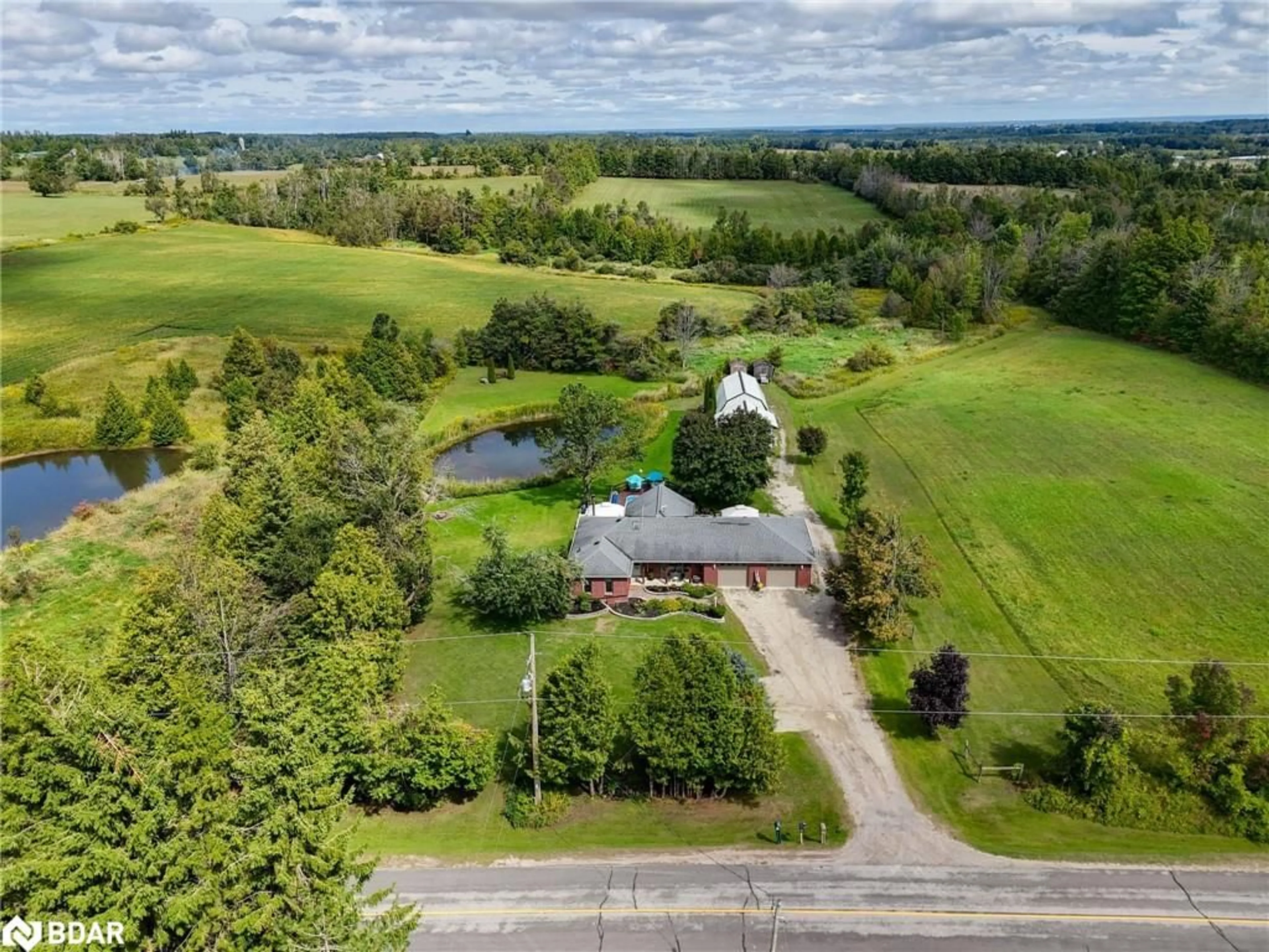 A pic from outside/outdoor area/front of a property/back of a property/a pic from drone, unknown for 1171 9 Line, Oro-Medonte Ontario L0L 1T0