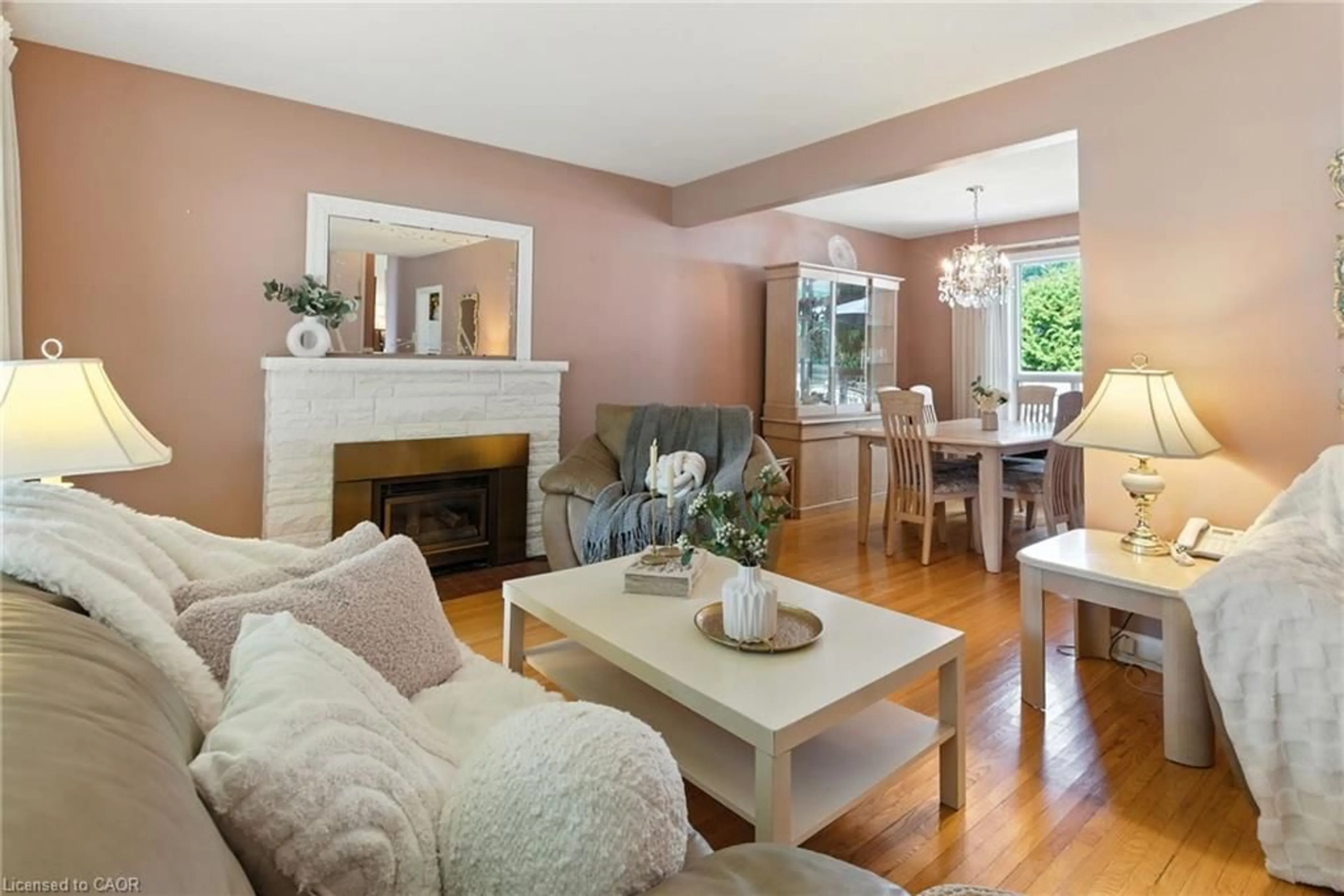 Living room with furniture, wood/laminate floor for 1001 Brucedale St, Hamilton Ontario L8T 1M6