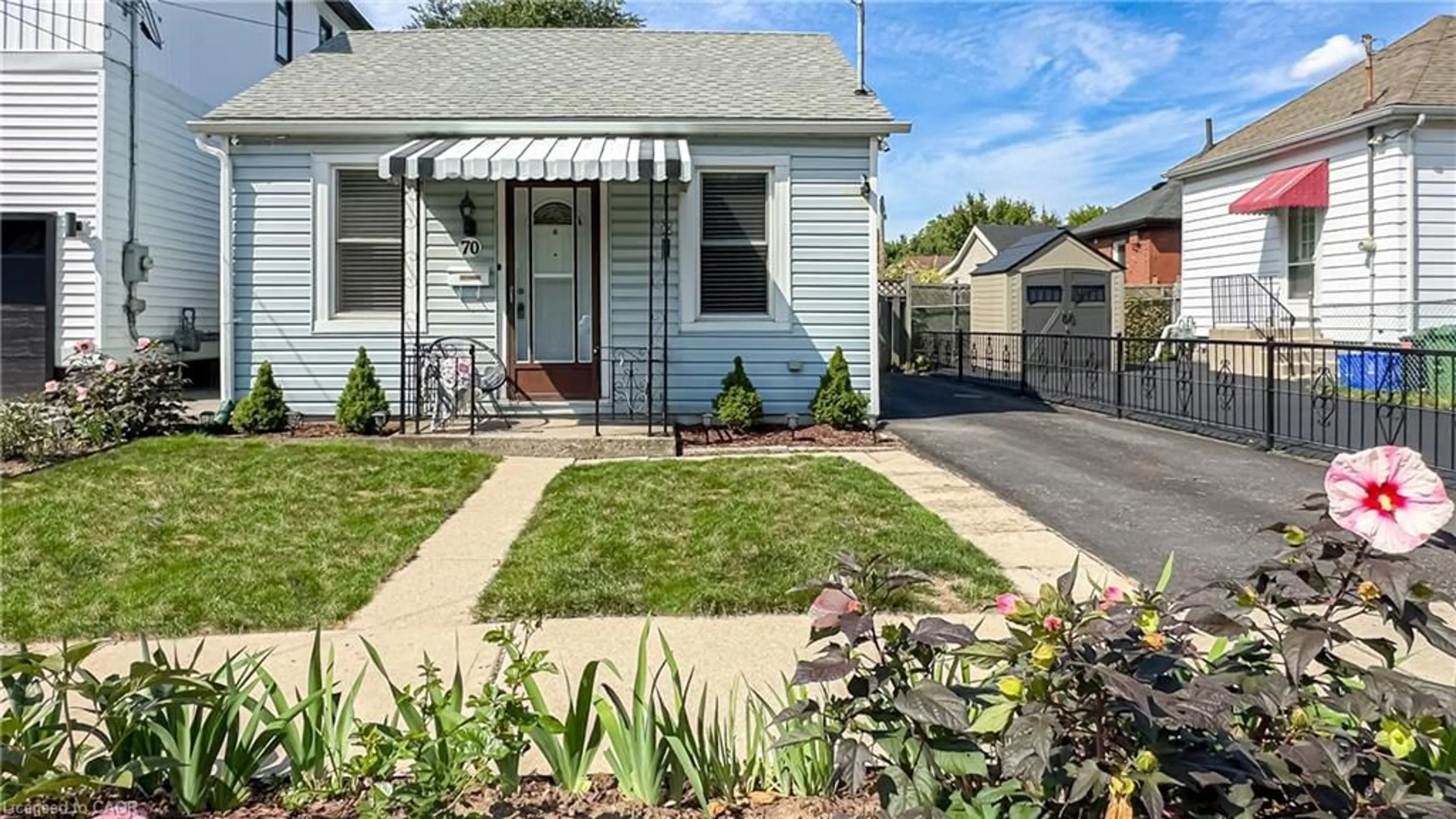 Home with vinyl exterior material, street for 70 Poulette St, Hamilton Ontario L8P 4E2