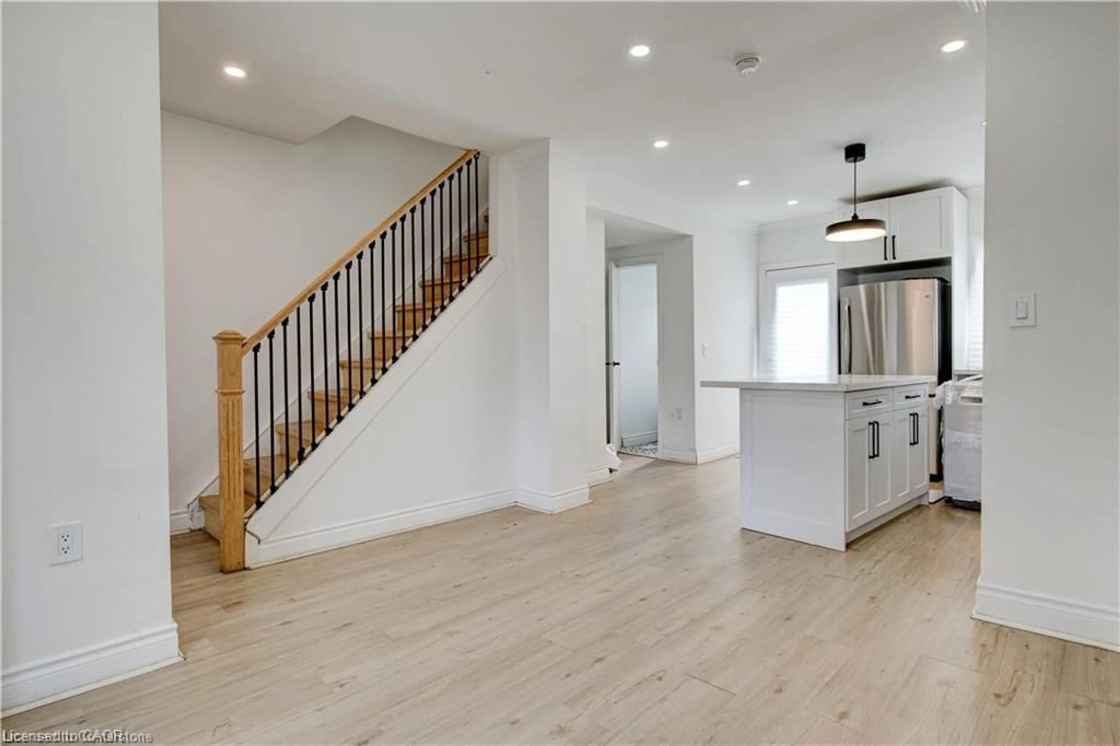 Open concept kitchen, wood/laminate floor for 104 Avondale St, Hamilton Ontario L8L 7B8