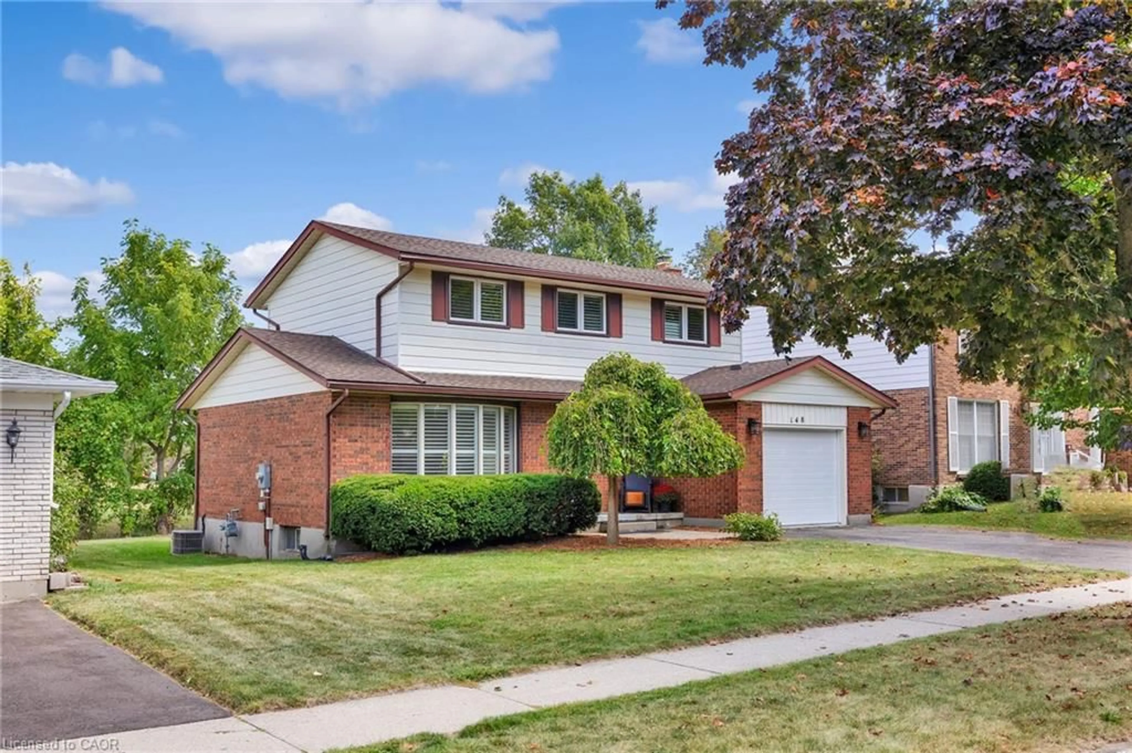 Home with brick exterior material, street for 148 Candlewood Cres, Waterloo Ontario N2L 5T4