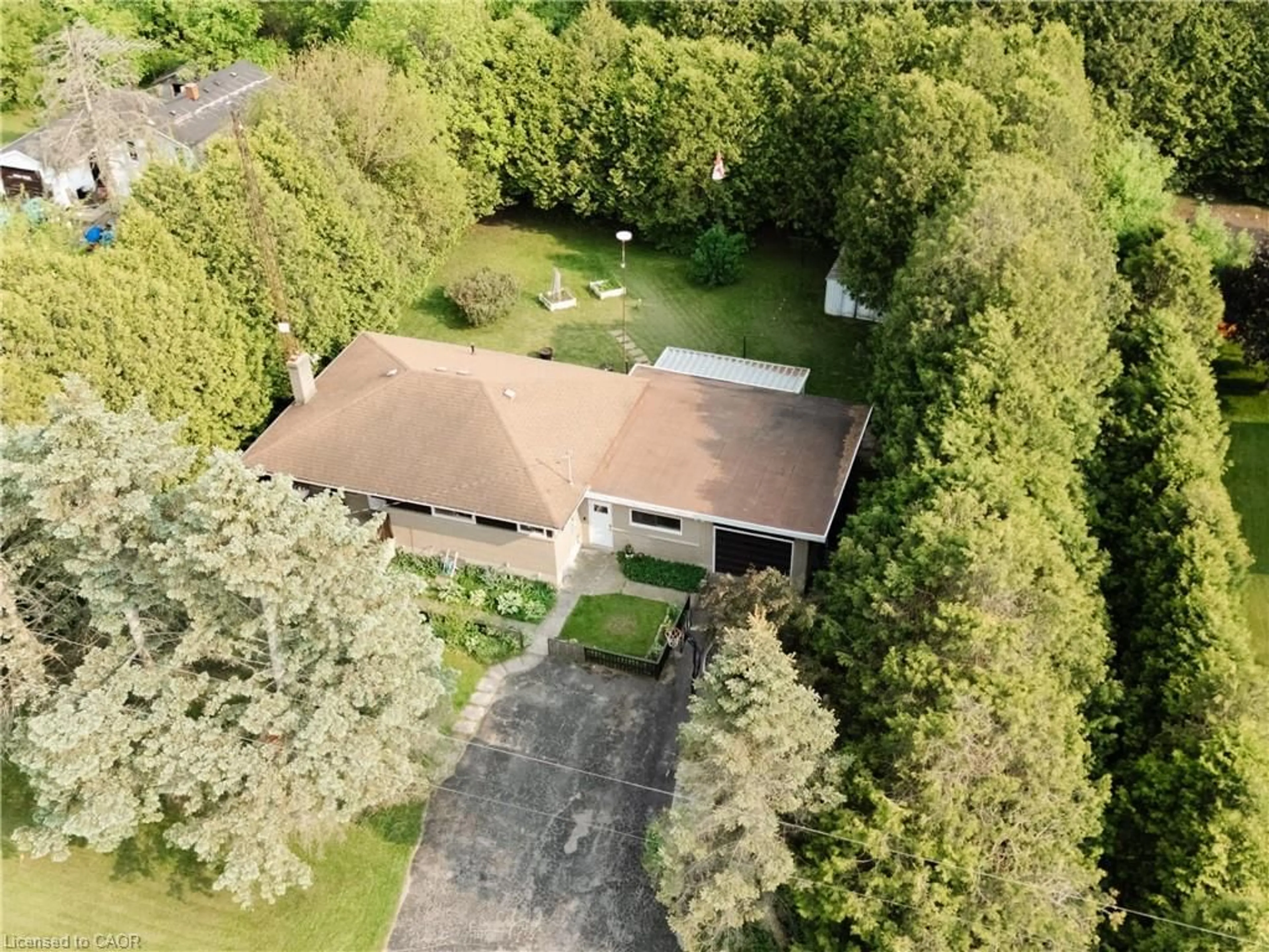A pic from outside/outdoor area/front of a property/back of a property/a pic from drone, unknown for 252 Windham Road 13, Delhi Ontario N4B 2W5