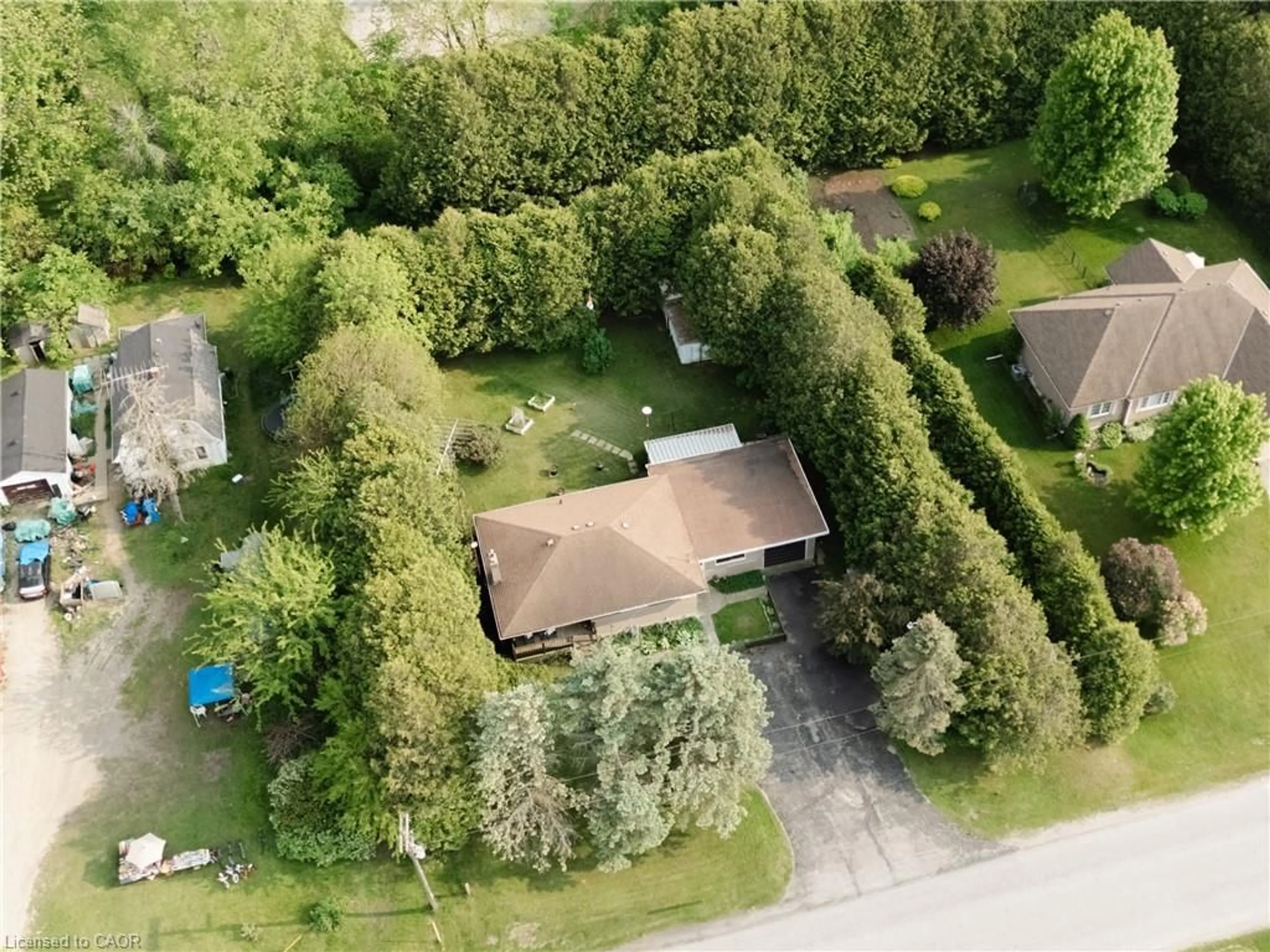 A pic from outside/outdoor area/front of a property/back of a property/a pic from drone, unknown for 252 Windham Road 13, Delhi Ontario N4B 2W5