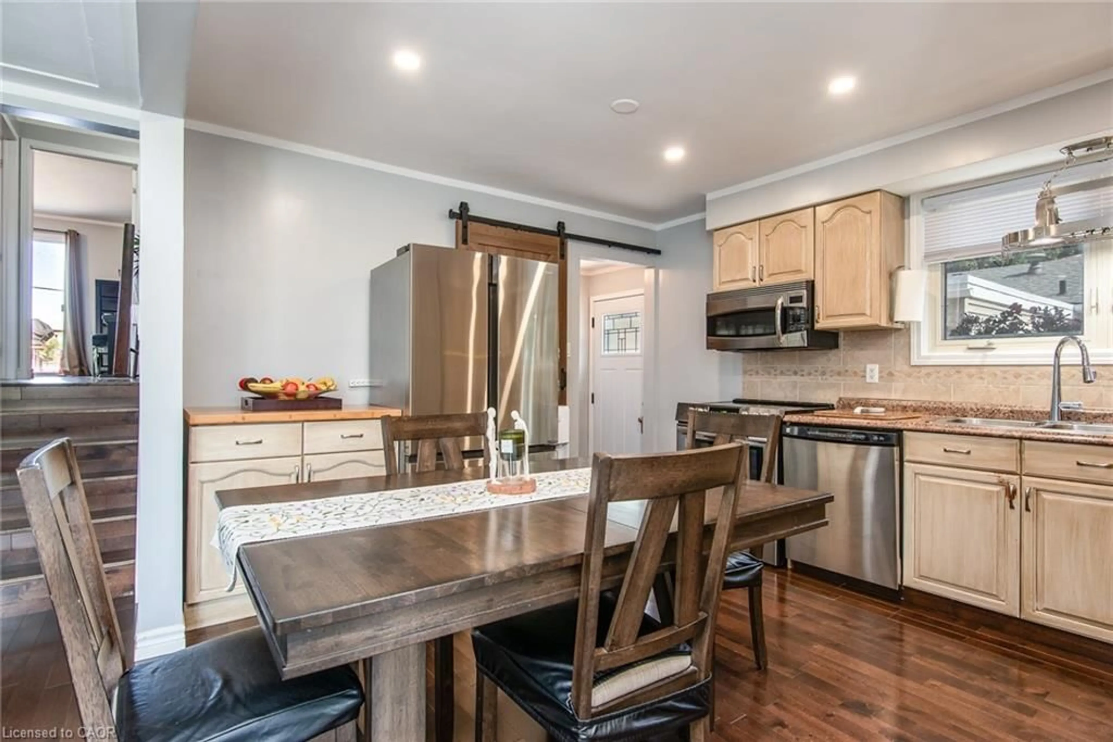 Open concept kitchen, wood/laminate floor for 77 Roberts Cres, Kitchener Ontario N2E 1A6