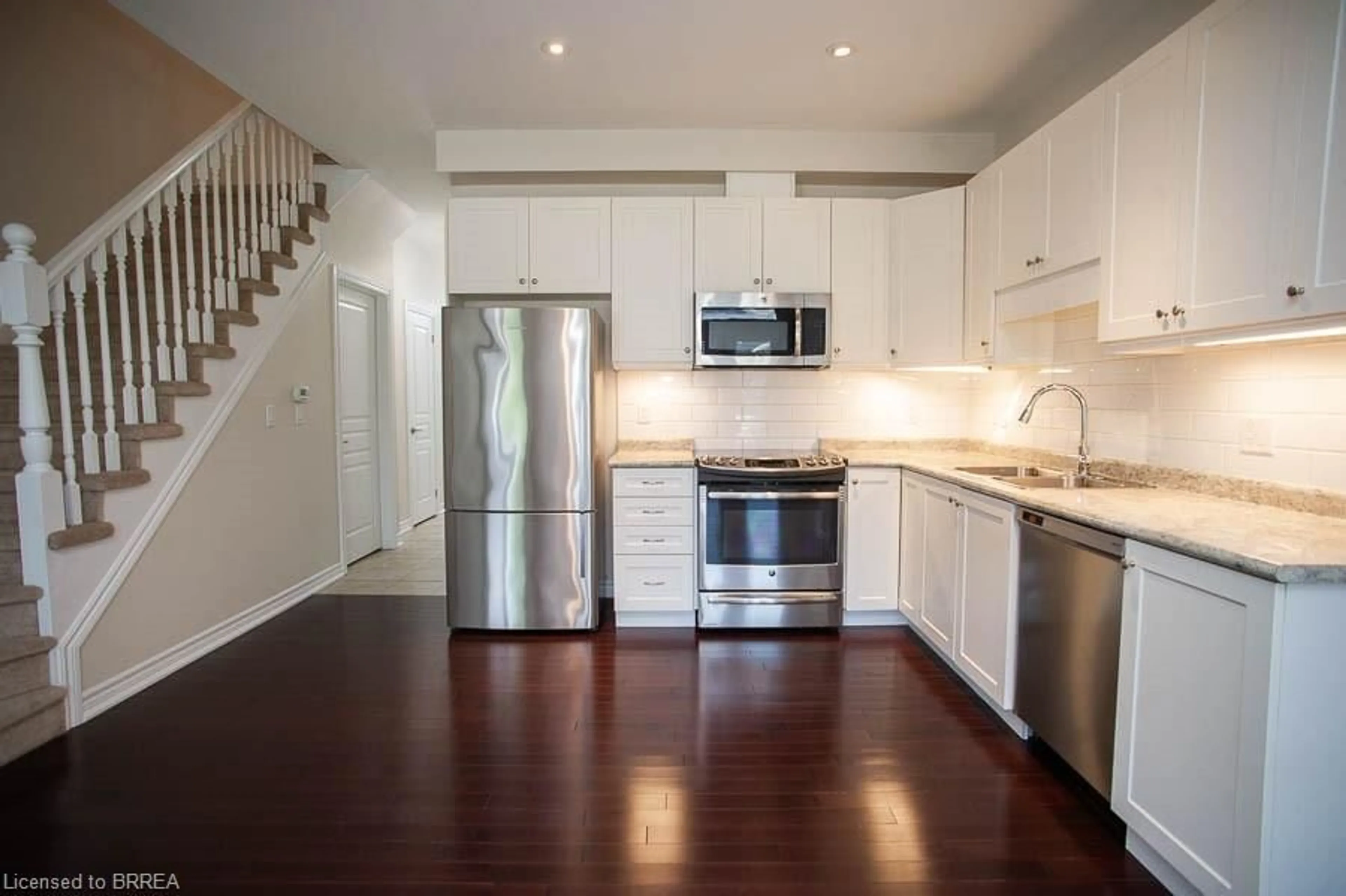 Open concept kitchen, wood/laminate floor for 80 Willow St #59, Paris Ontario N3L 2K6