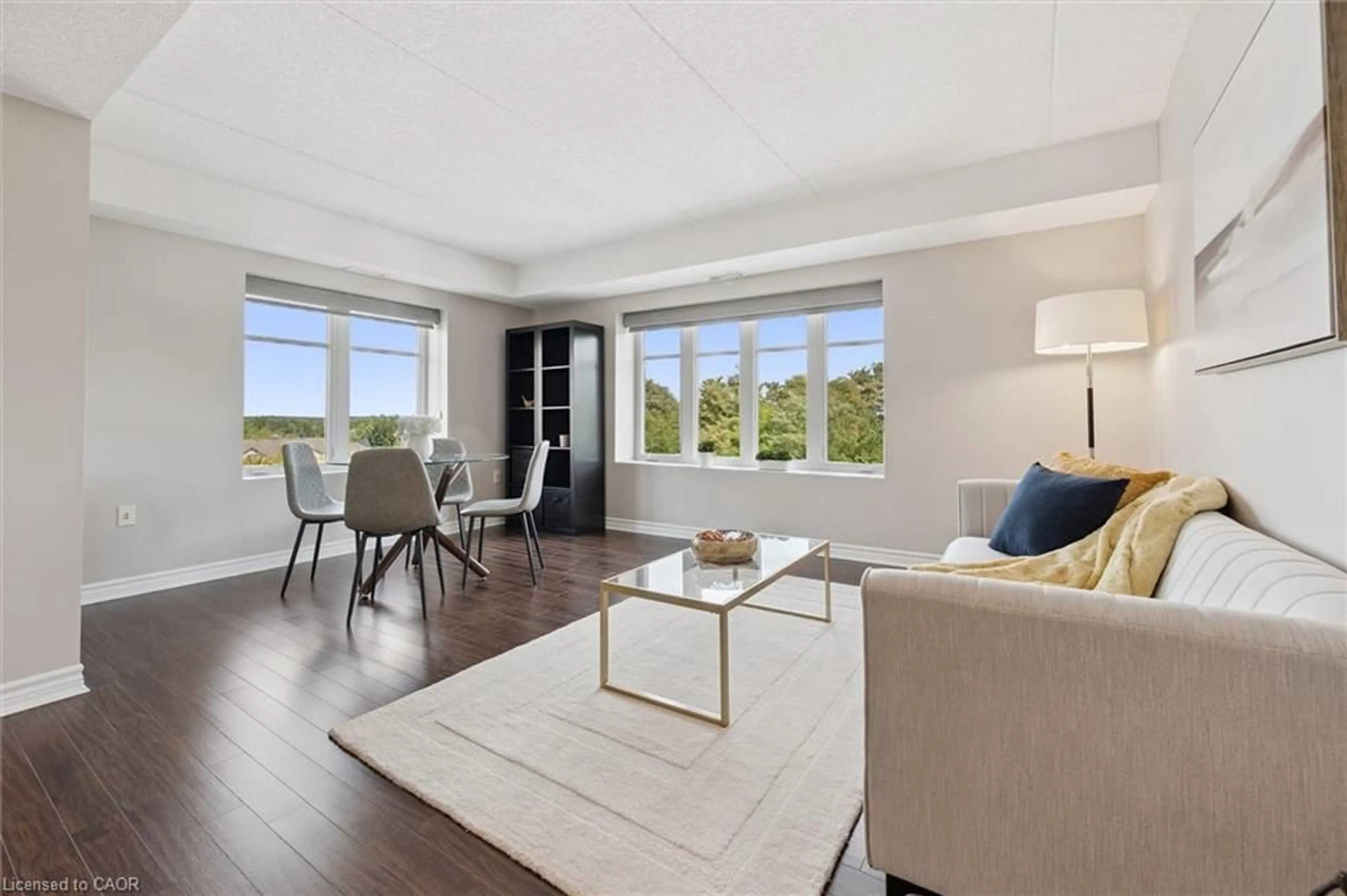 Living room with furniture, wood/laminate floor for 776 Laurelwood Dr #301, Waterloo Ontario N2V 0A8