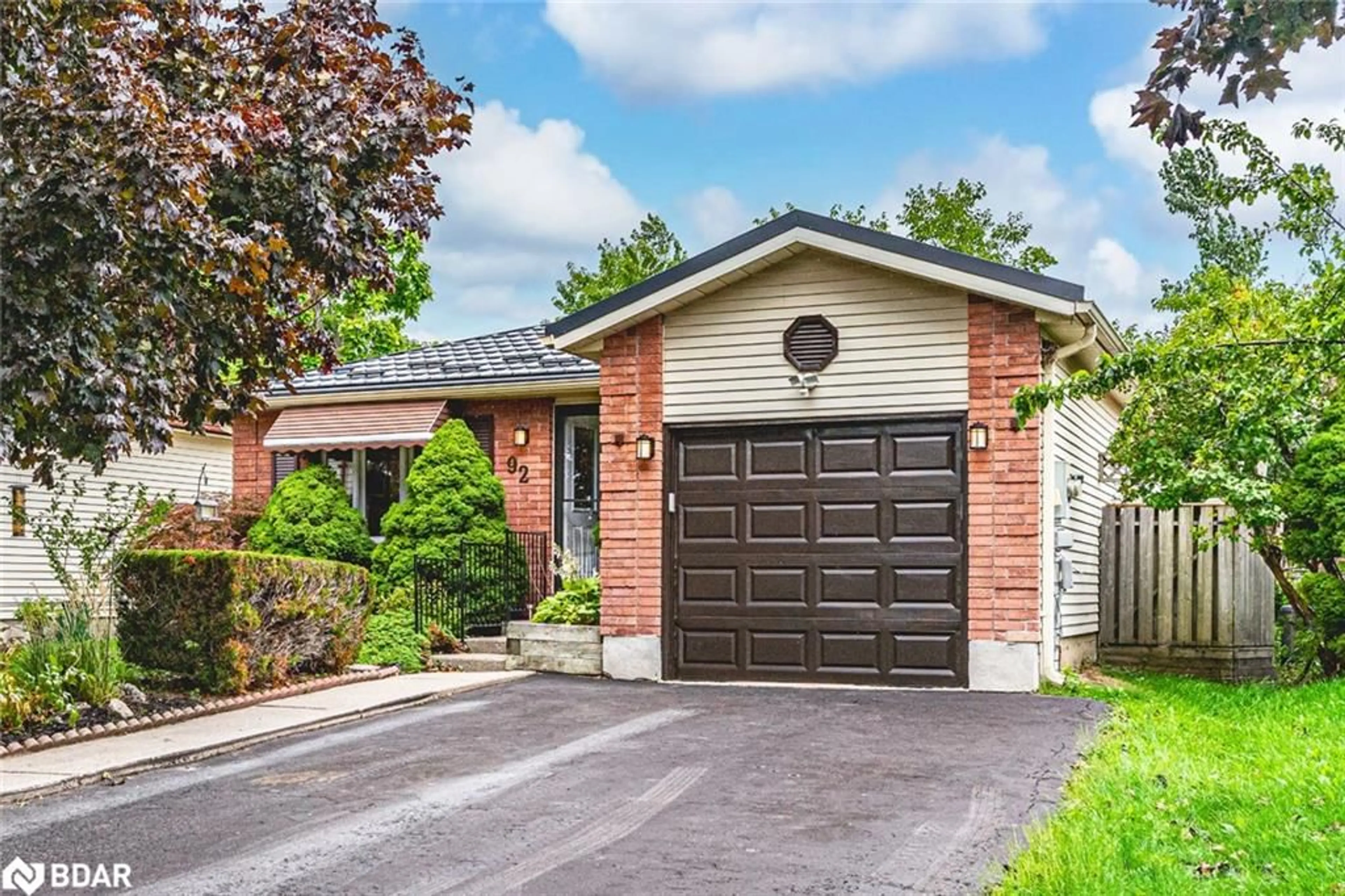 Home with brick exterior material, street for 92 Hickling Trail, Barrie Ontario L4M 5T3