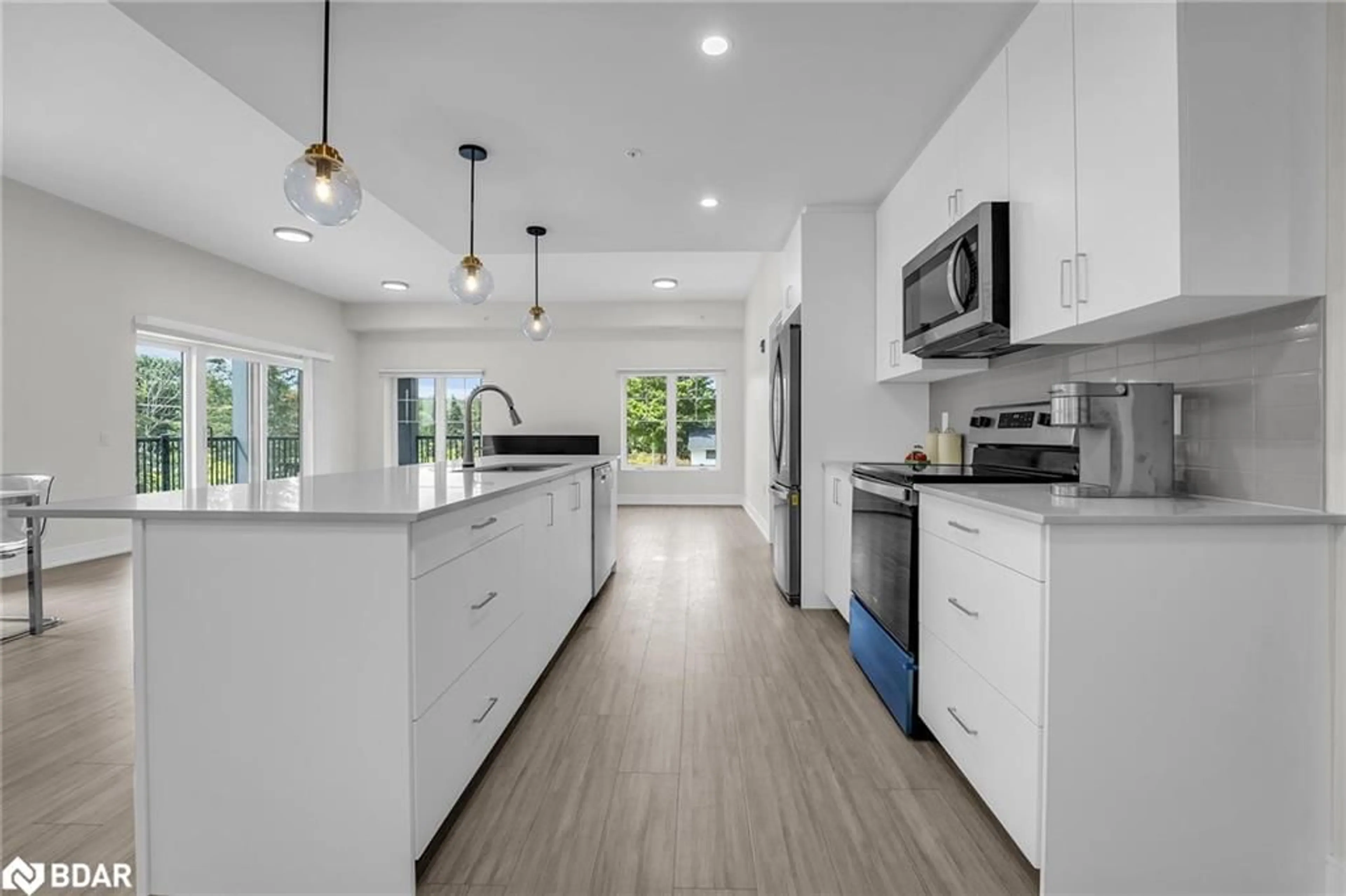 Open concept kitchen, ceramic/tile floor for 121 Mary St #211, Creemore Ontario L0M 1G0