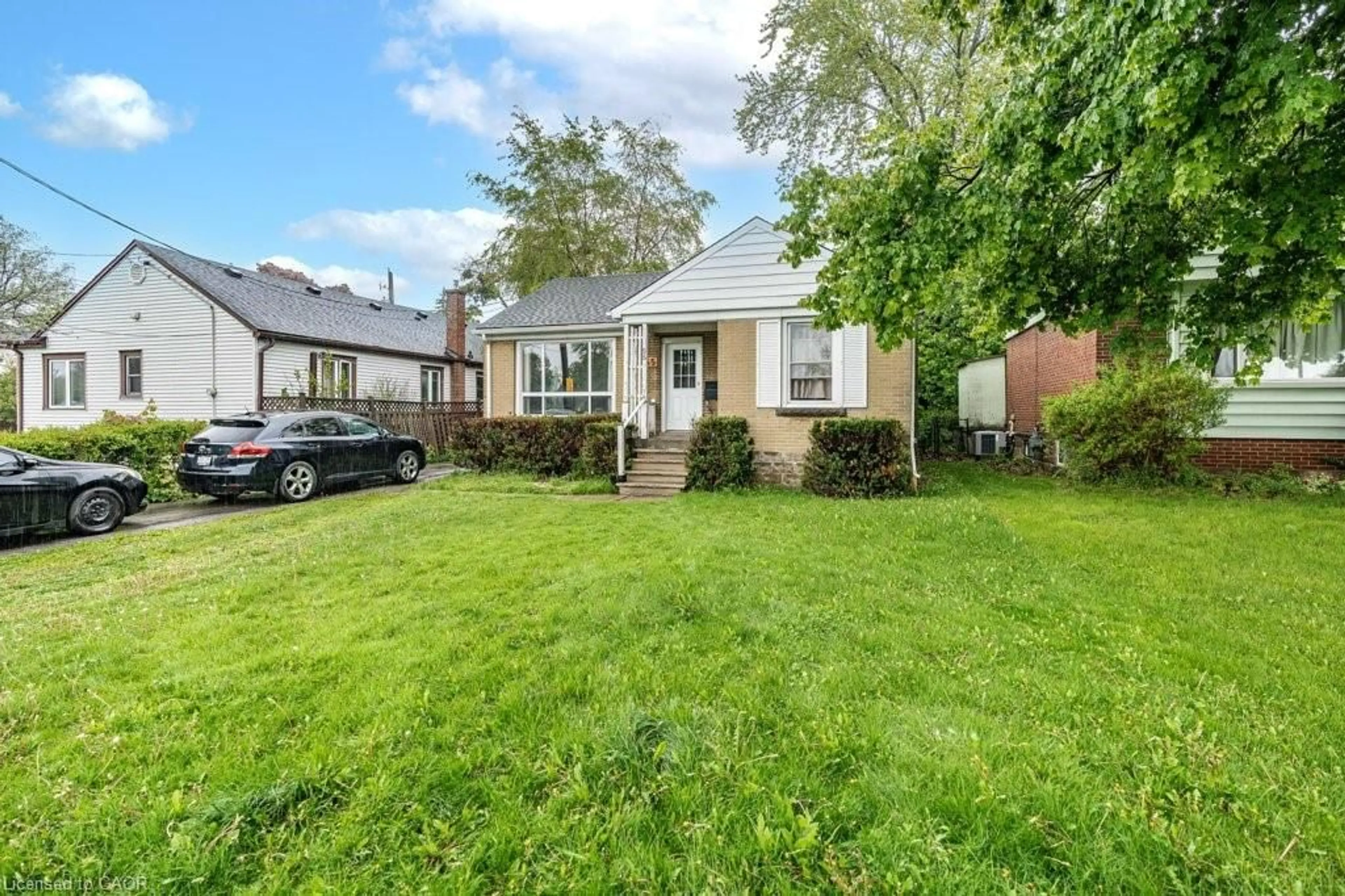 A pic from outside/outdoor area/front of a property/back of a property/a pic from drone, street for 55 West 5th St, Hamilton Ontario L9C 3N7