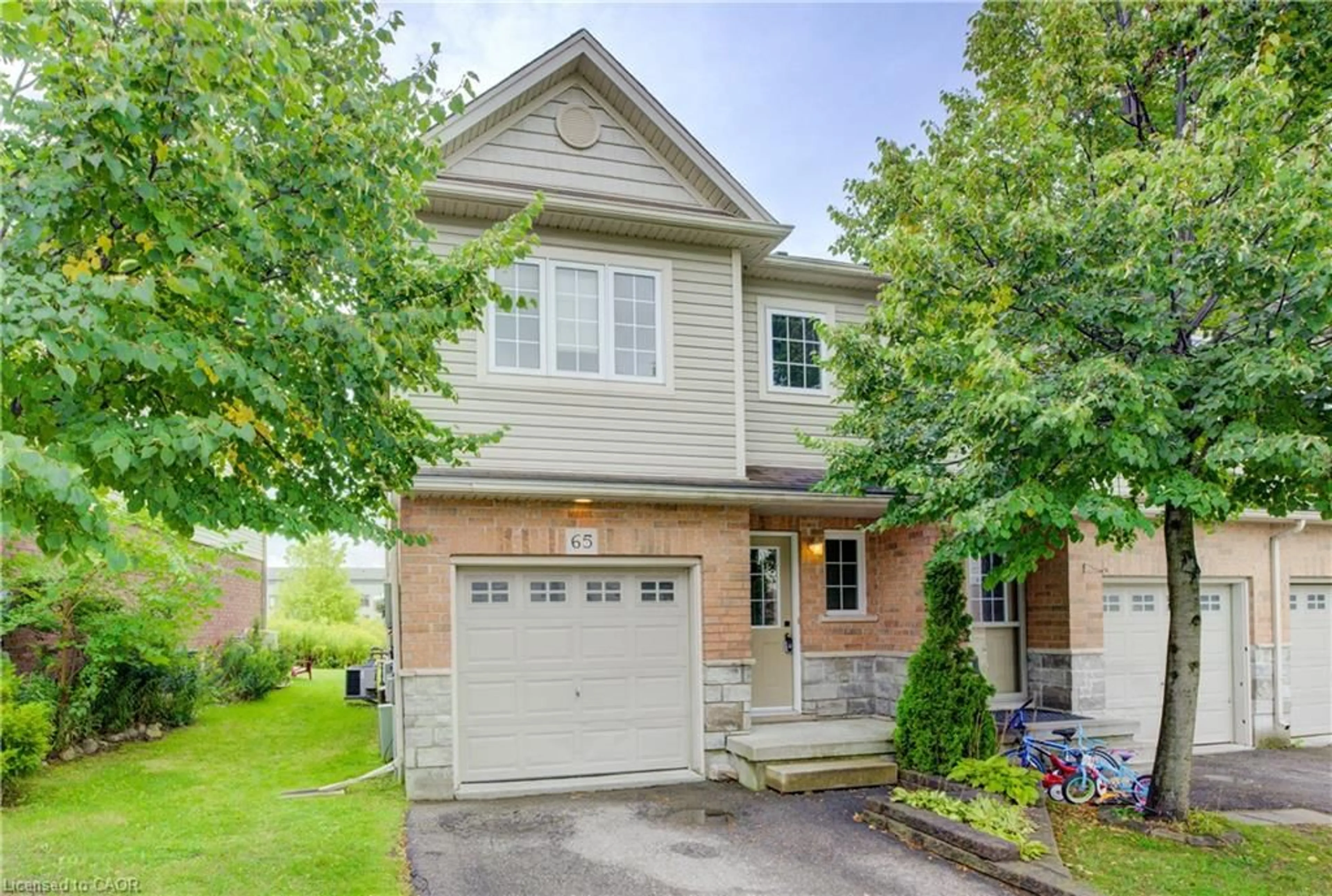 Home with brick exterior material, street for 355 Fisher Mills Rd #65, Cambridge Ontario N3C 4N5