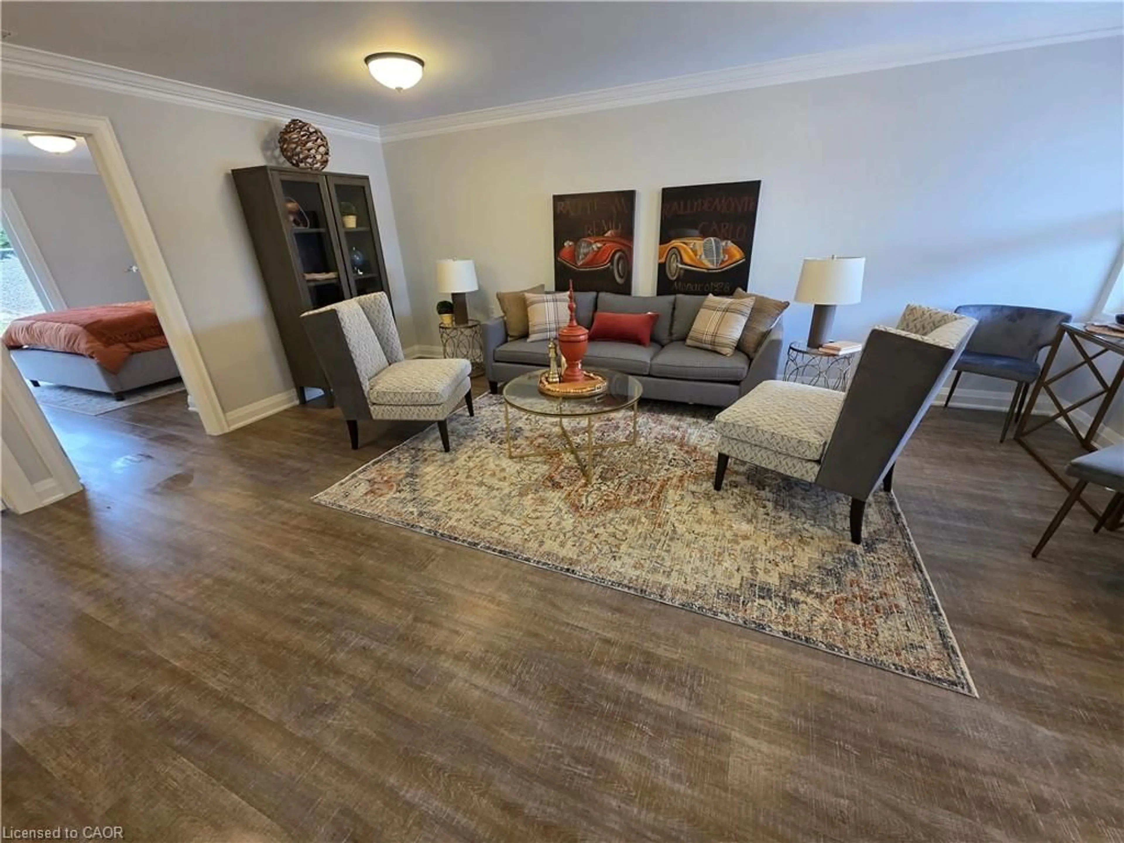 Living room with furniture, wood/laminate floor for 40 Szollosy Cir, Hamilton Ontario L9B 1T8