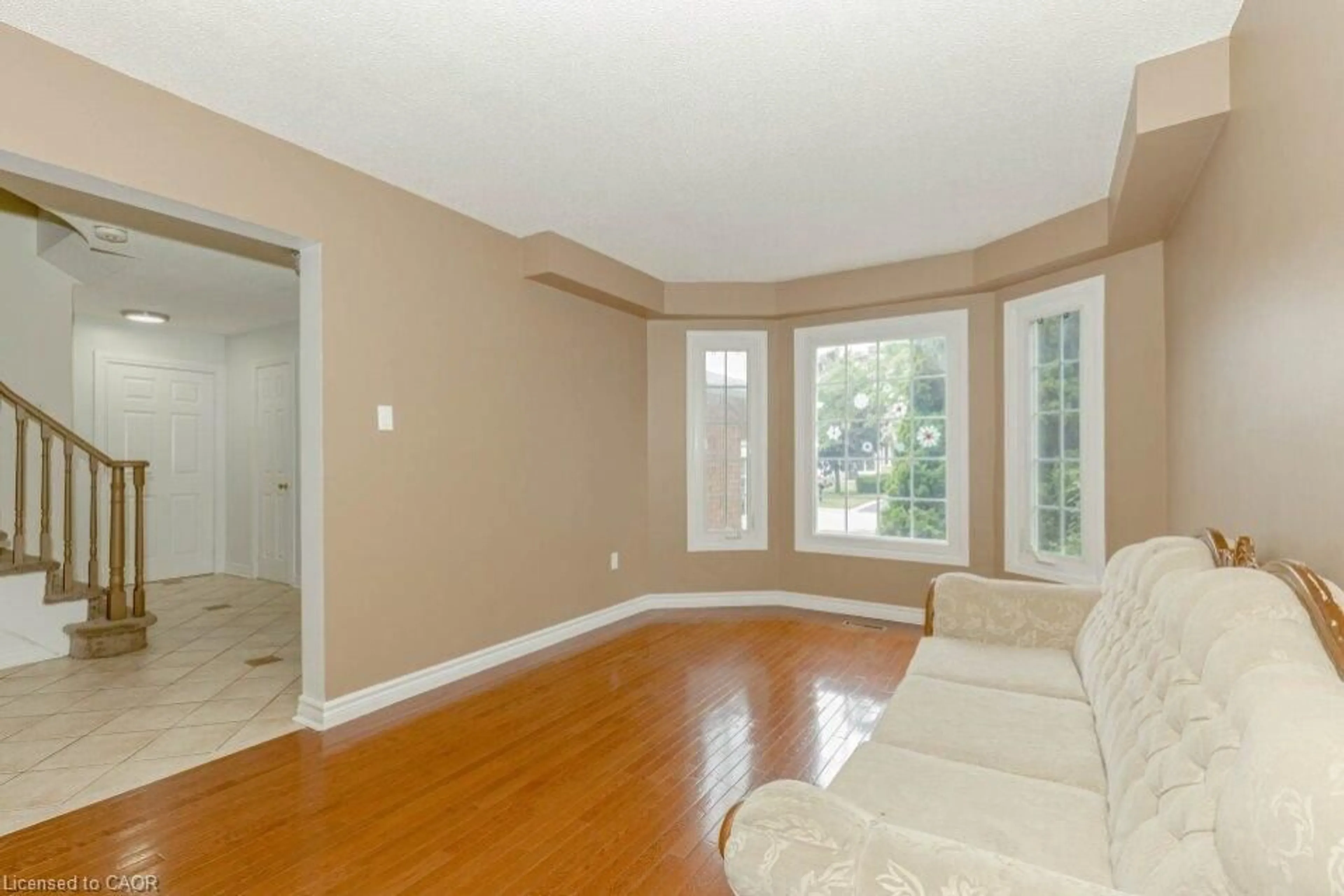Living room with furniture, wood/laminate floor for 5118 Cree Lane, Mississauga Ontario L4Z 3B4
