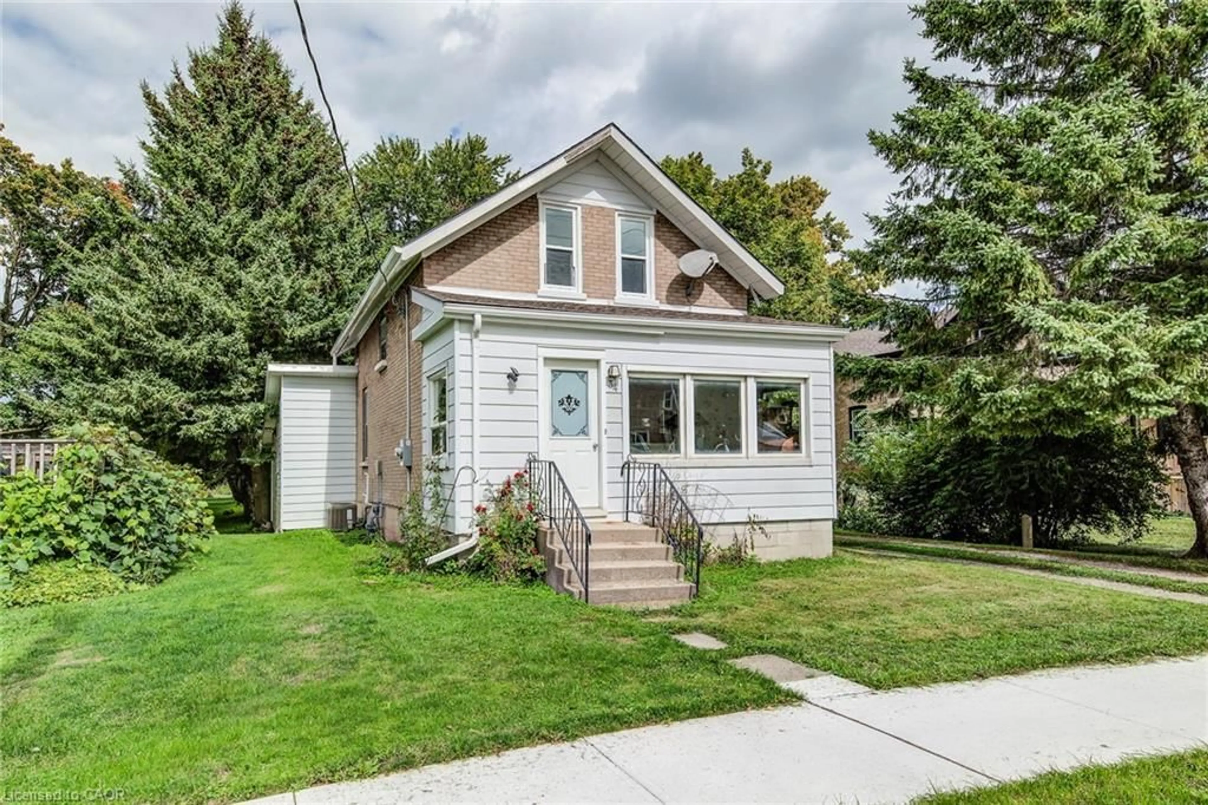 Home with vinyl exterior material, street for 34 Wood St, Drayton Ontario N0G 1P0