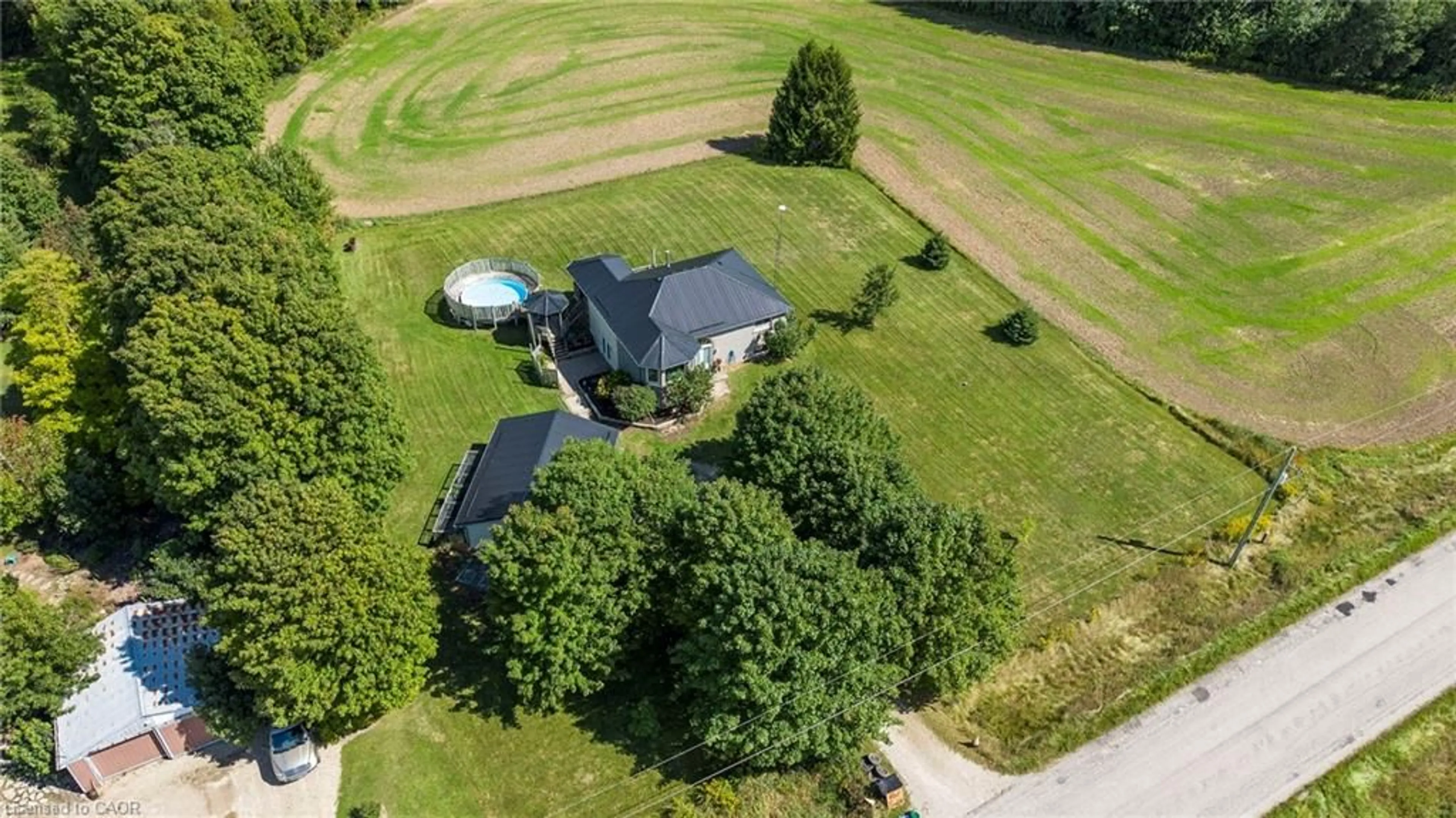 A pic from outside/outdoor area/front of a property/back of a property/a pic from drone, unknown for 8893 School Road 7, Palmerston Ontario N0G 2P0