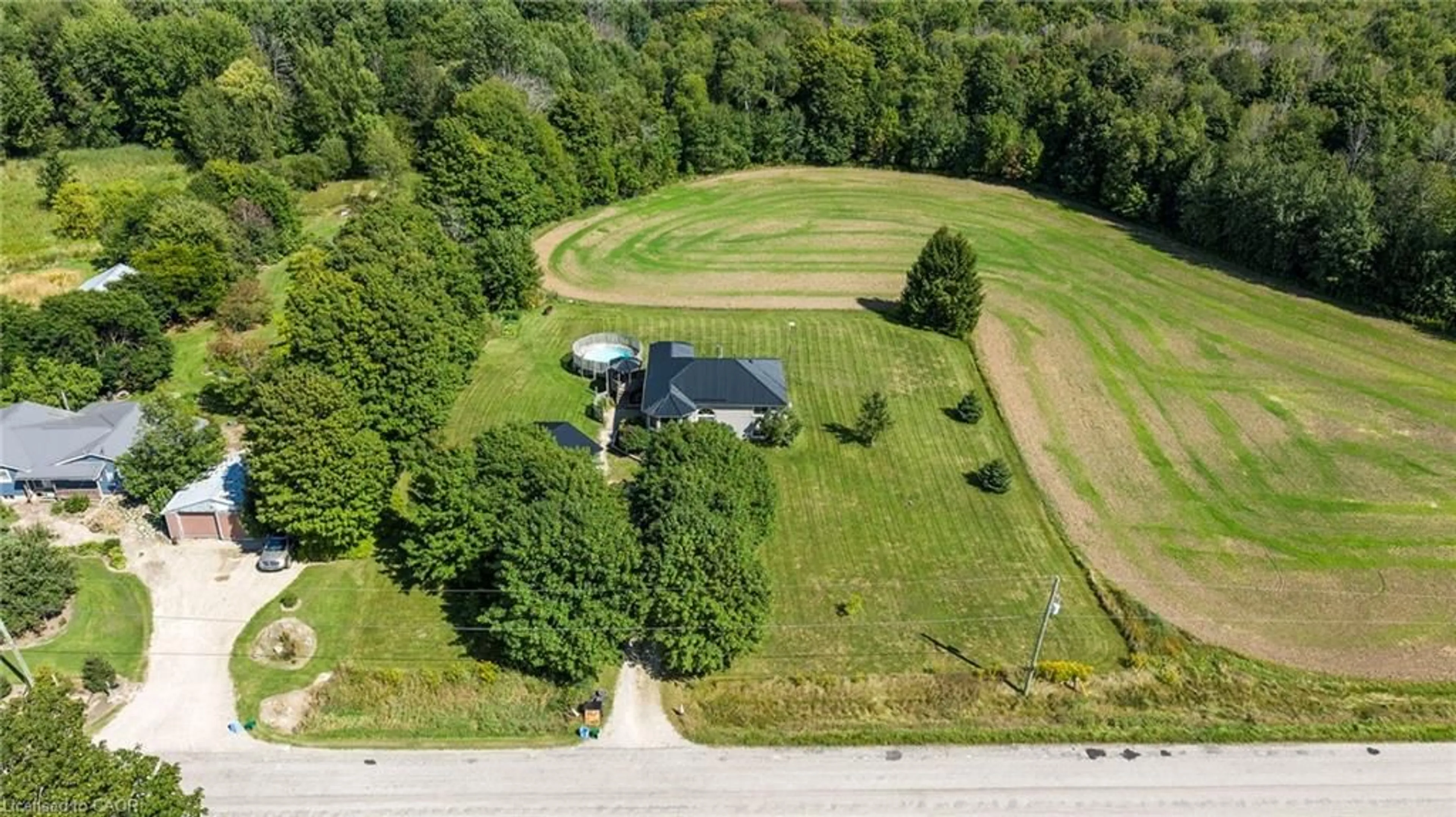 A pic from outside/outdoor area/front of a property/back of a property/a pic from drone, unknown for 8893 School Road 7, Palmerston Ontario N0G 2P0