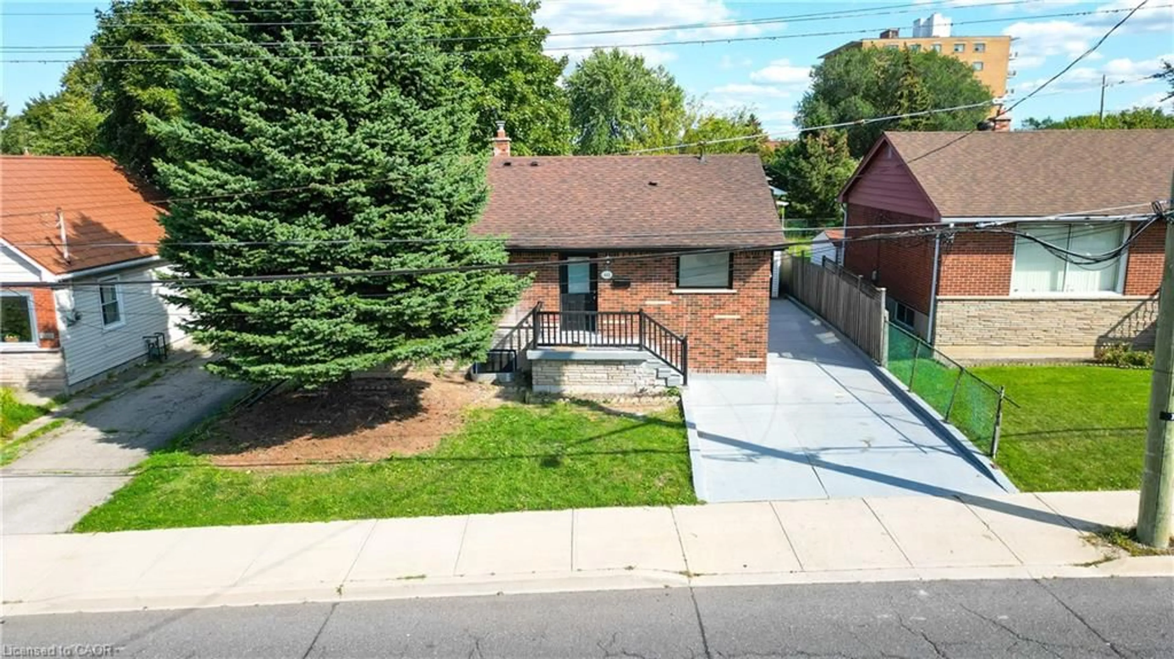 Home with brick exterior material, street for 441 West 5th St, Hamilton Ontario L9C 3P5