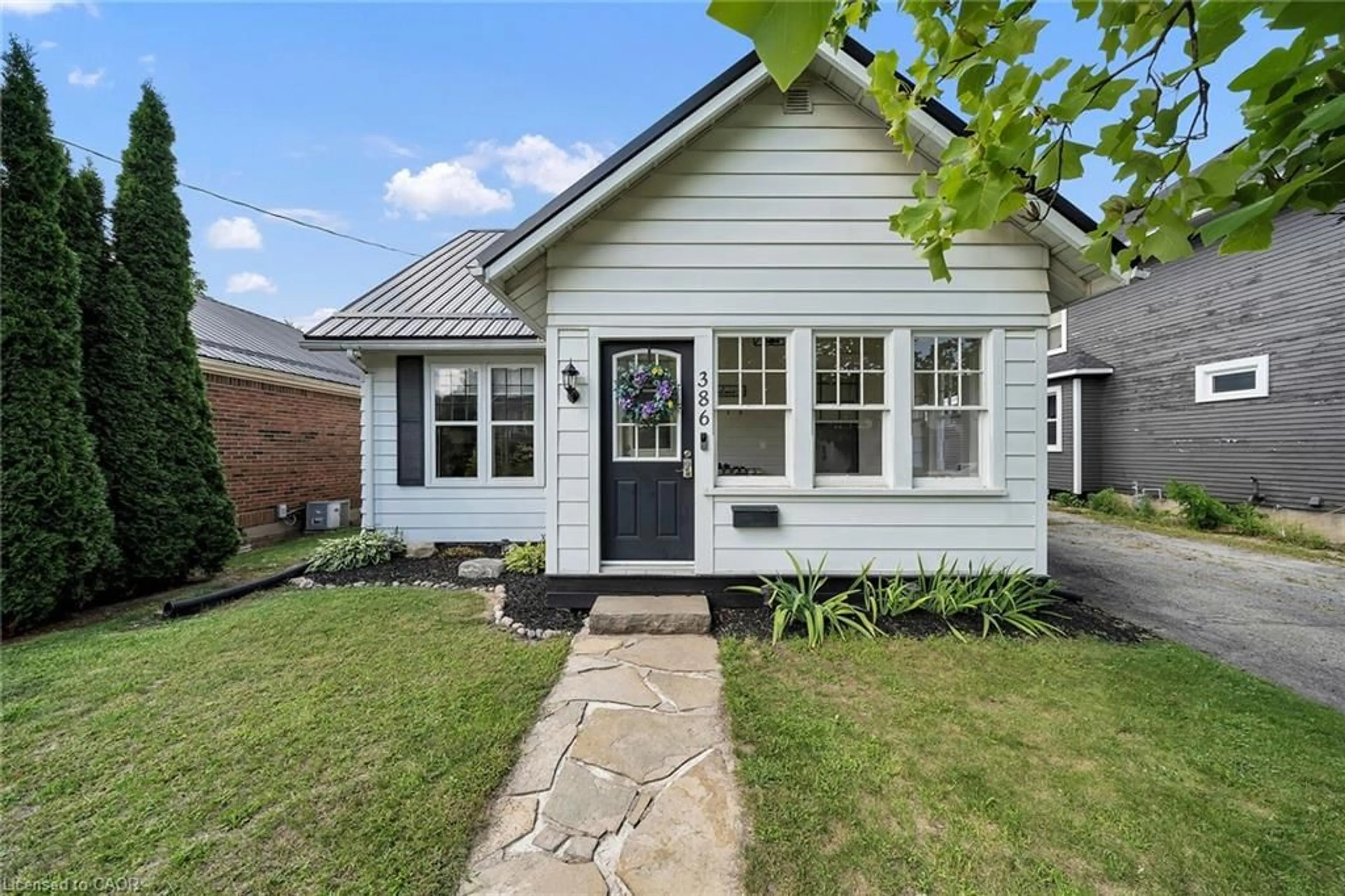 Home with brick exterior material, street for 386 College Ave, Simcoe Ontario N3Y 4G9