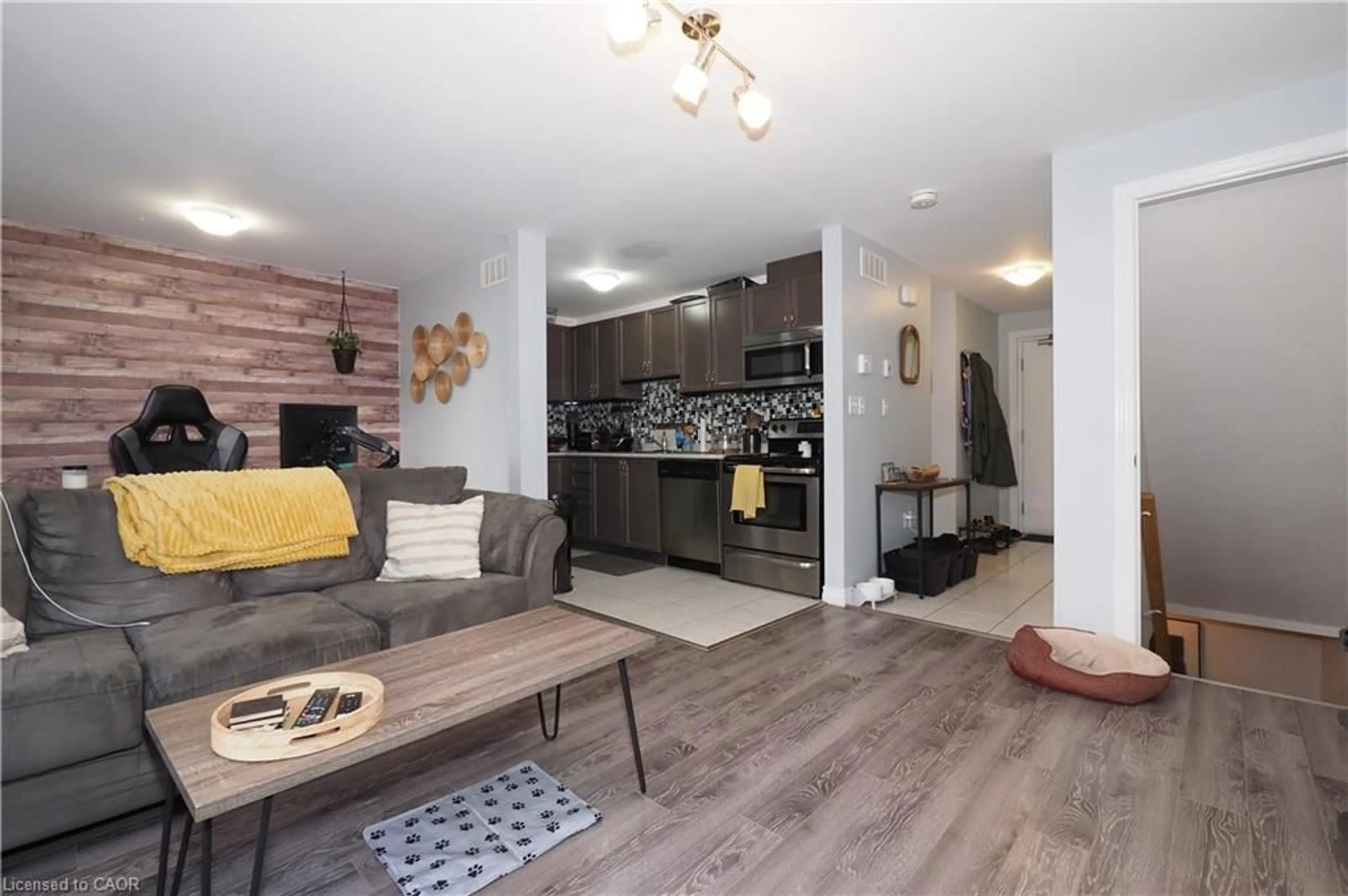Living room with furniture, wood/laminate floor for 55 Mooregate Cres #12A, Kitchener Ontario N2M 0A6