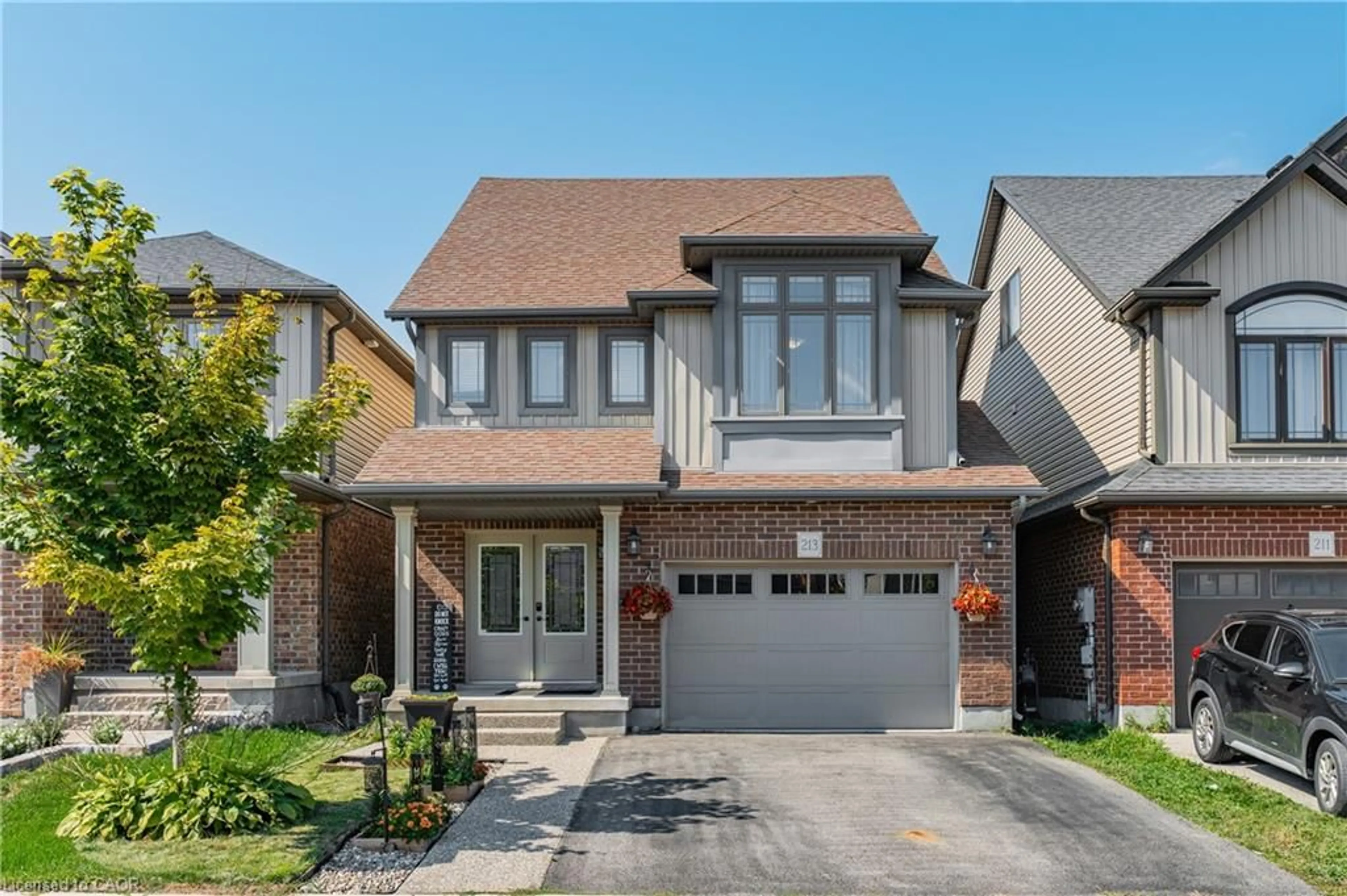 Home with brick exterior material, street for 213 Couling Cres, Guelph Ontario N1E 0L4