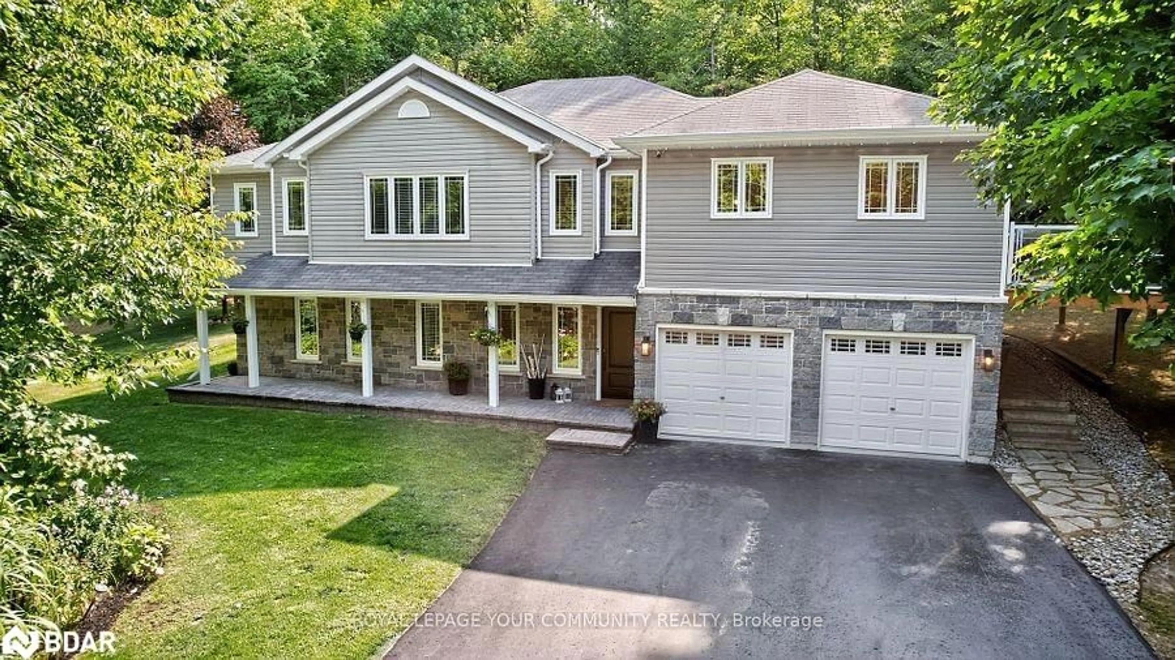 A pic from outside/outdoor area/front of a property/back of a property/a pic from drone, street for 135 Huron Woods Drive, Coldwater Ontario L0K 1E0