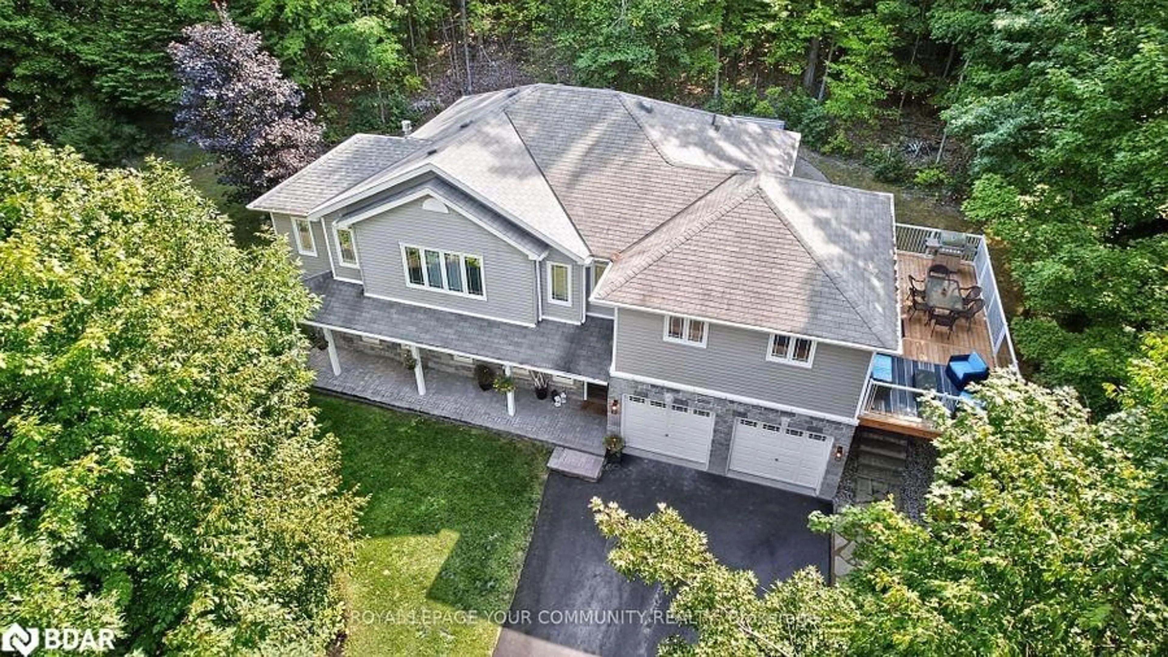 A pic from outside/outdoor area/front of a property/back of a property/a pic from drone, unknown for 135 Huron Woods Drive, Coldwater Ontario L0K 1E0