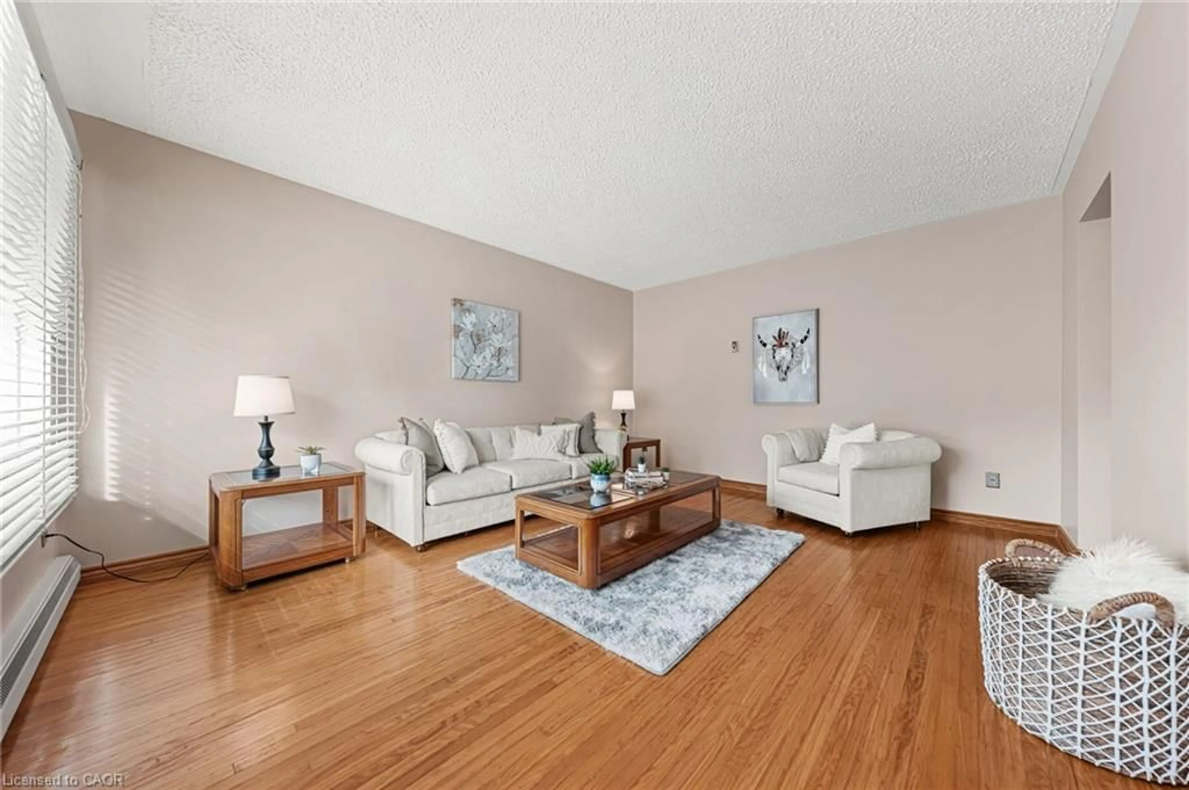 Living room with furniture, wood/laminate floor for 55 Lauris Ave, Cambridge Ontario N1R 5L5