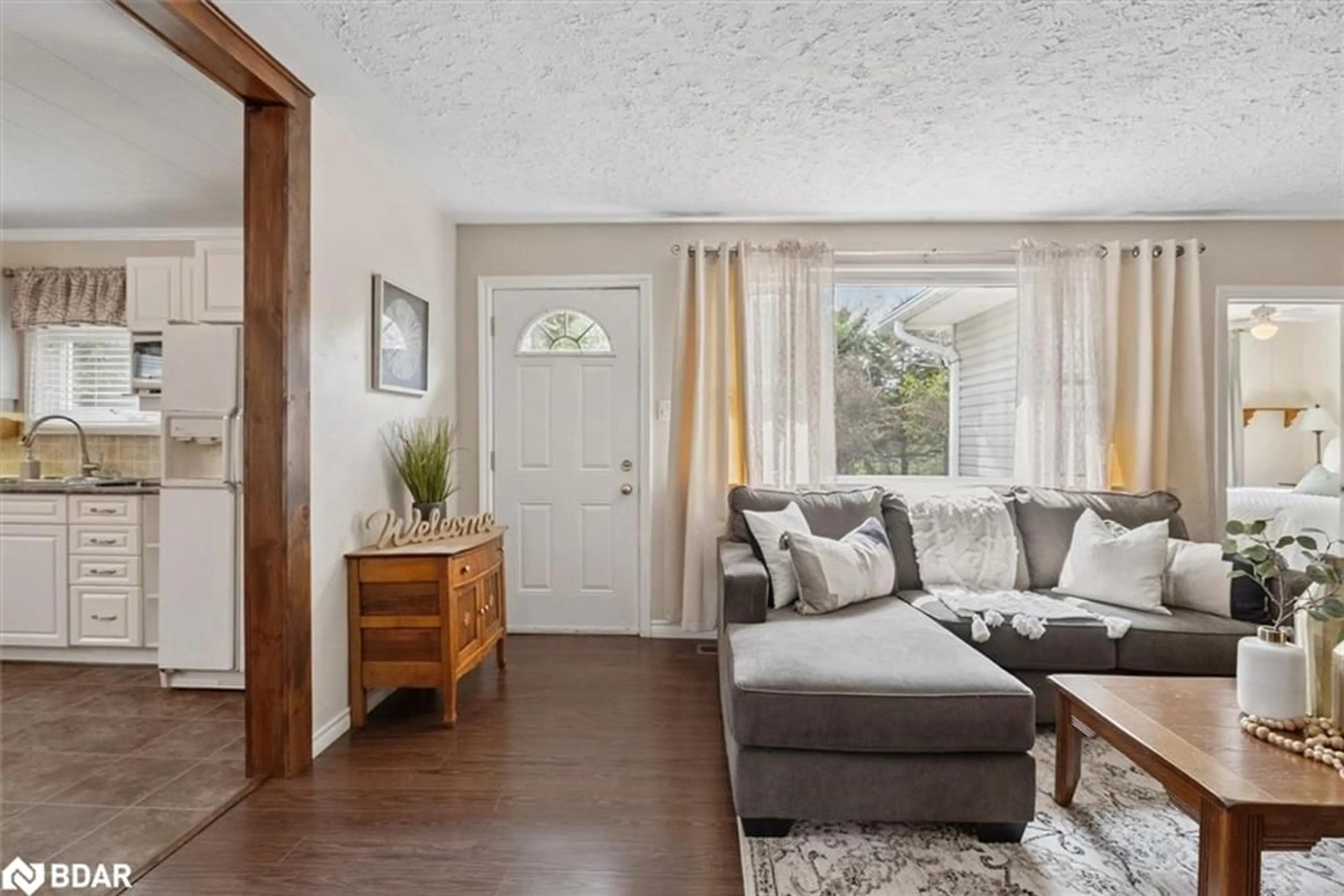 Living room with furniture, wood/laminate floor for 32805 Thorah Side Road, Beaverton Ontario L0K 1A0