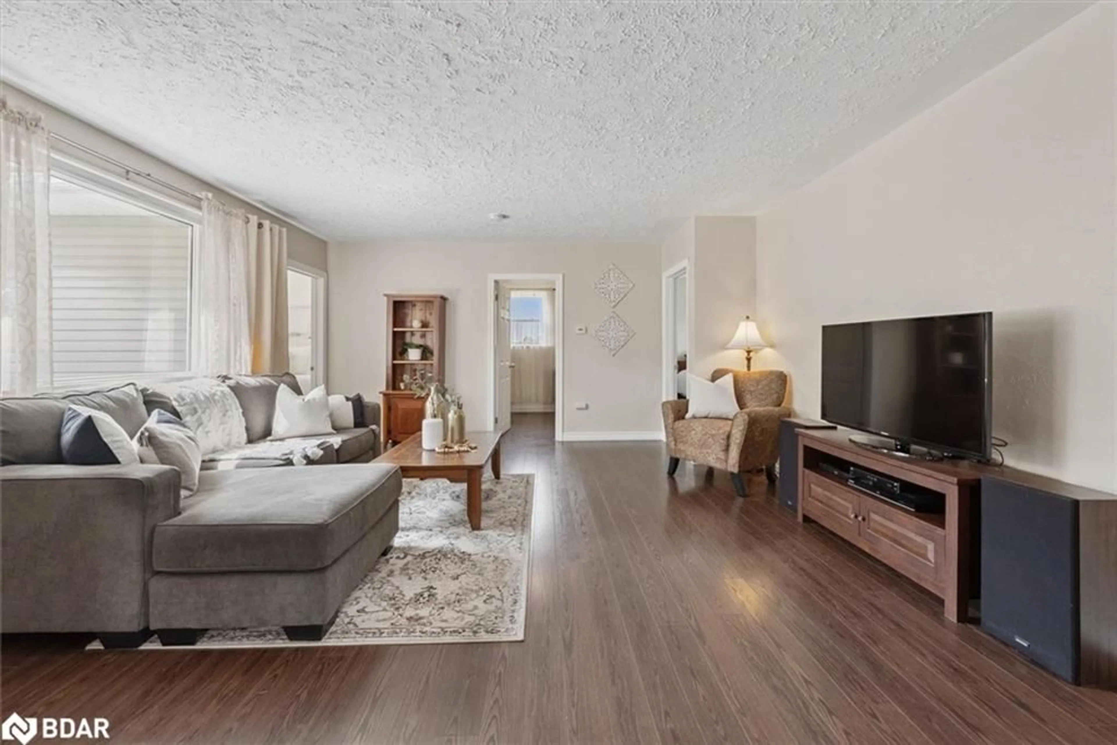 Living room with furniture, wood/laminate floor for 32805 Thorah Side Road, Beaverton Ontario L0K 1A0