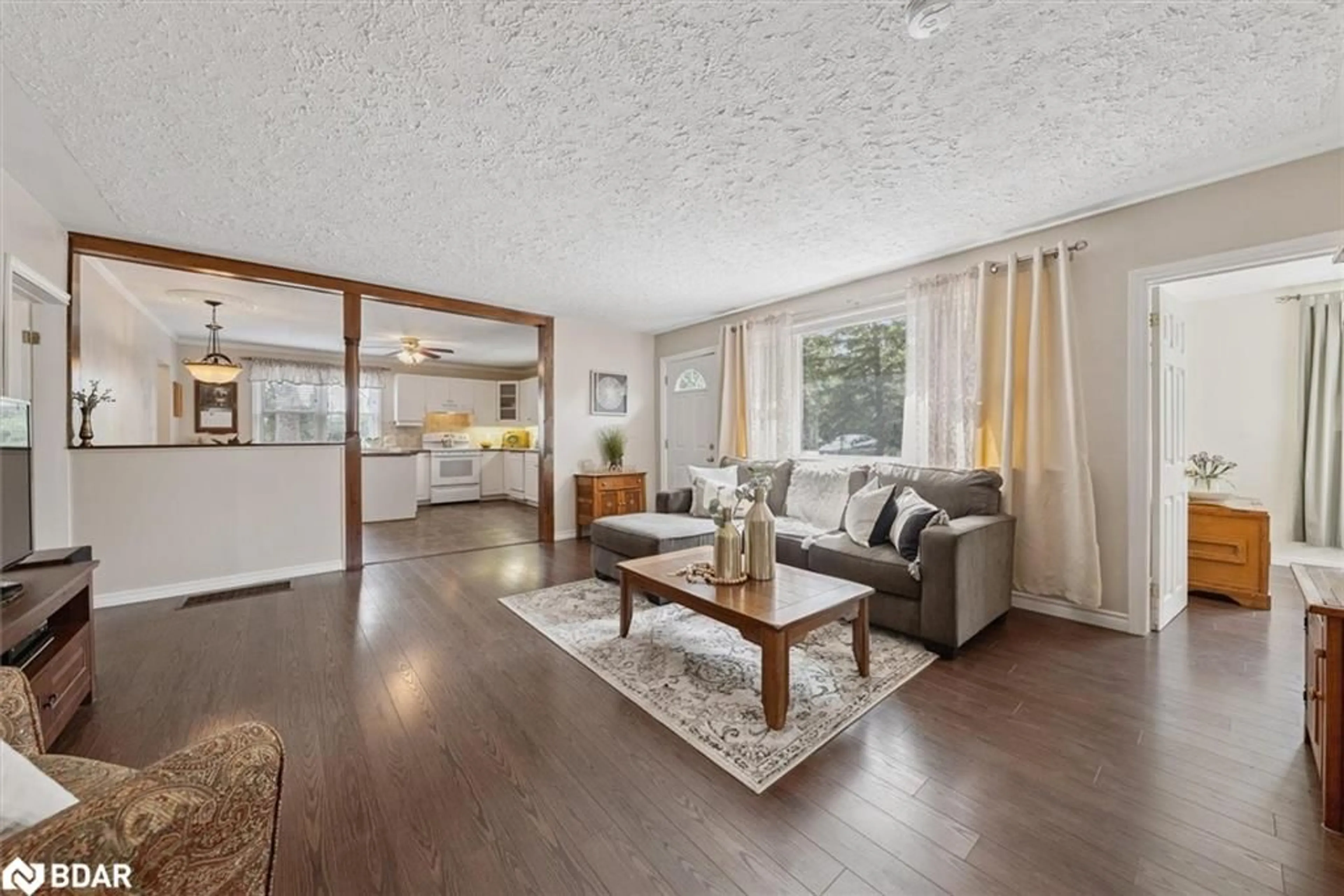 Living room with furniture, wood/laminate floor for 32805 Thorah Side Road, Beaverton Ontario L0K 1A0