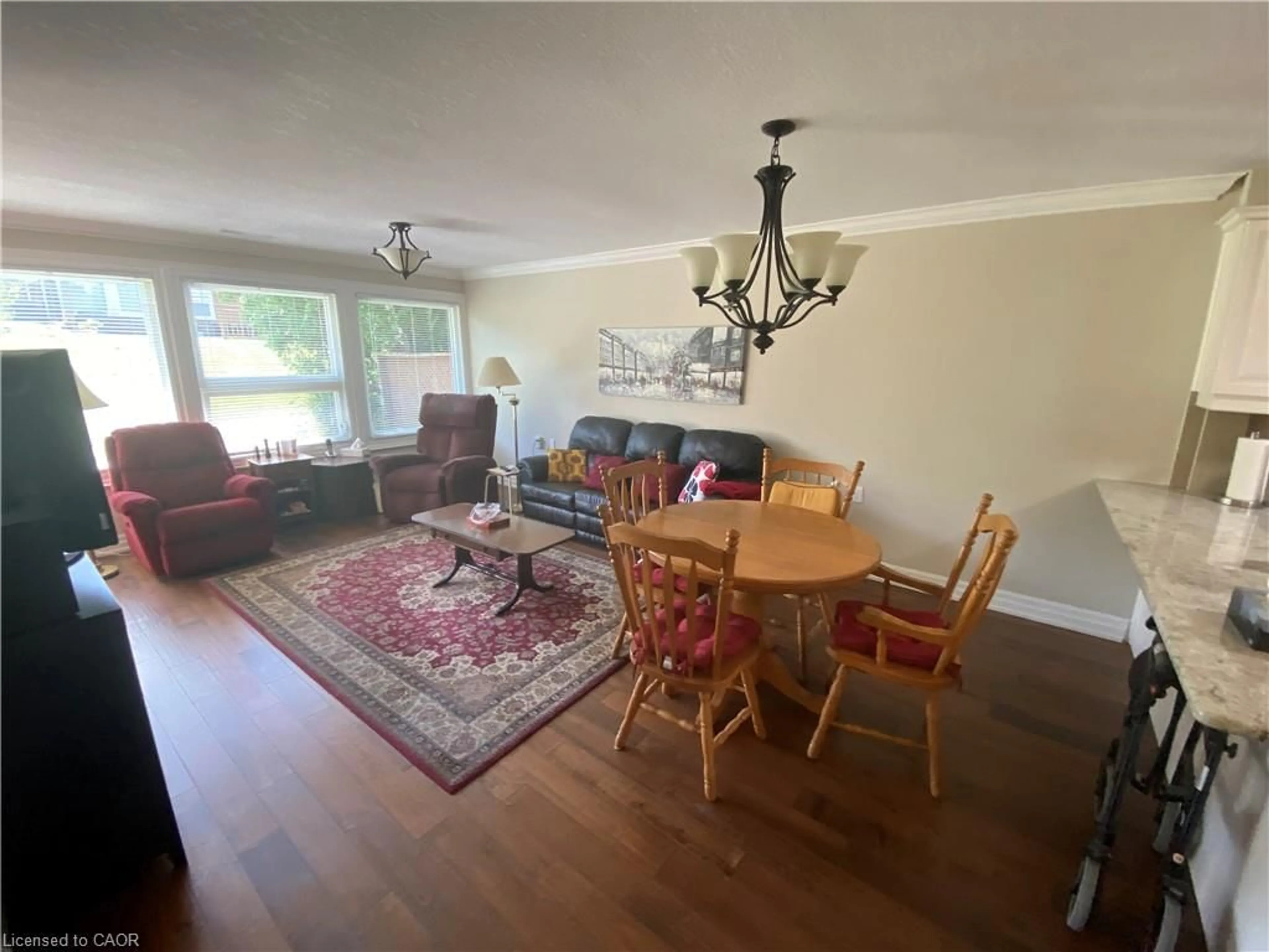 Living room with furniture, wood/laminate floor for 36 Mckenna Crt, Hamilton Ontario L9B 1T8