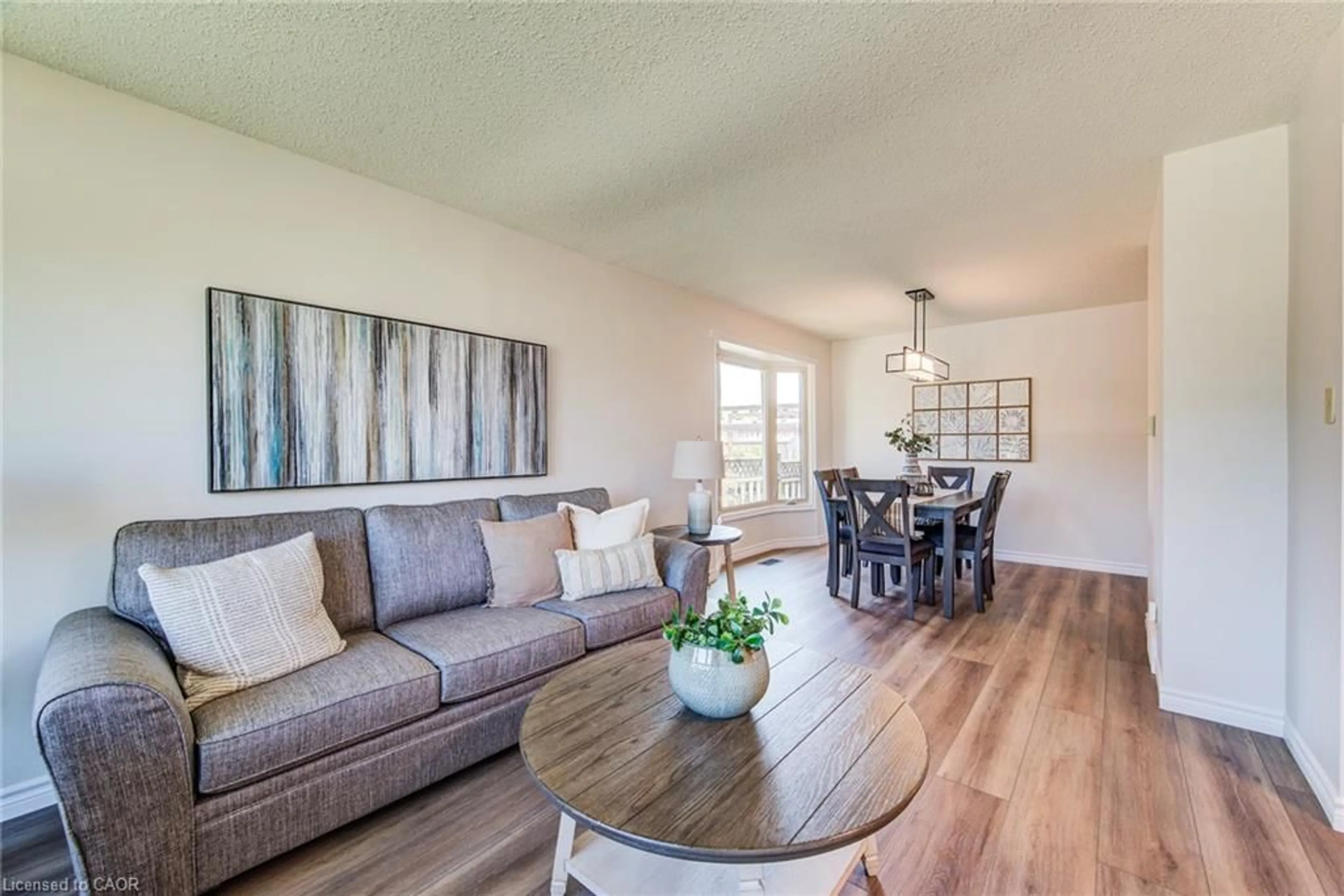 Living room with furniture, wood/laminate floor for 463 Thorndale Dr, Waterloo Ontario N2T 1V4