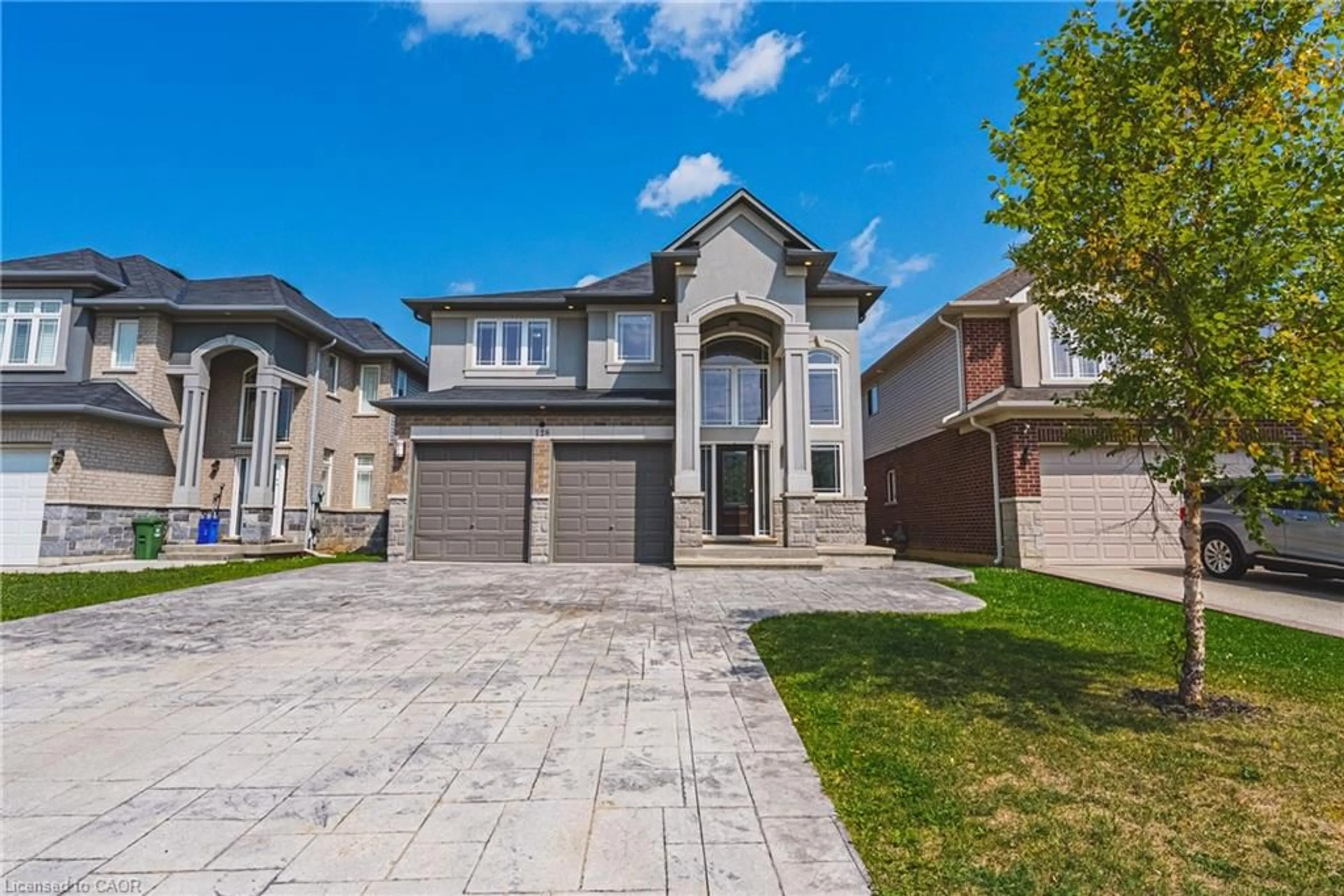 Home with brick exterior material, street for 128 Medici Lane, Hamilton Ontario L0R 1W0