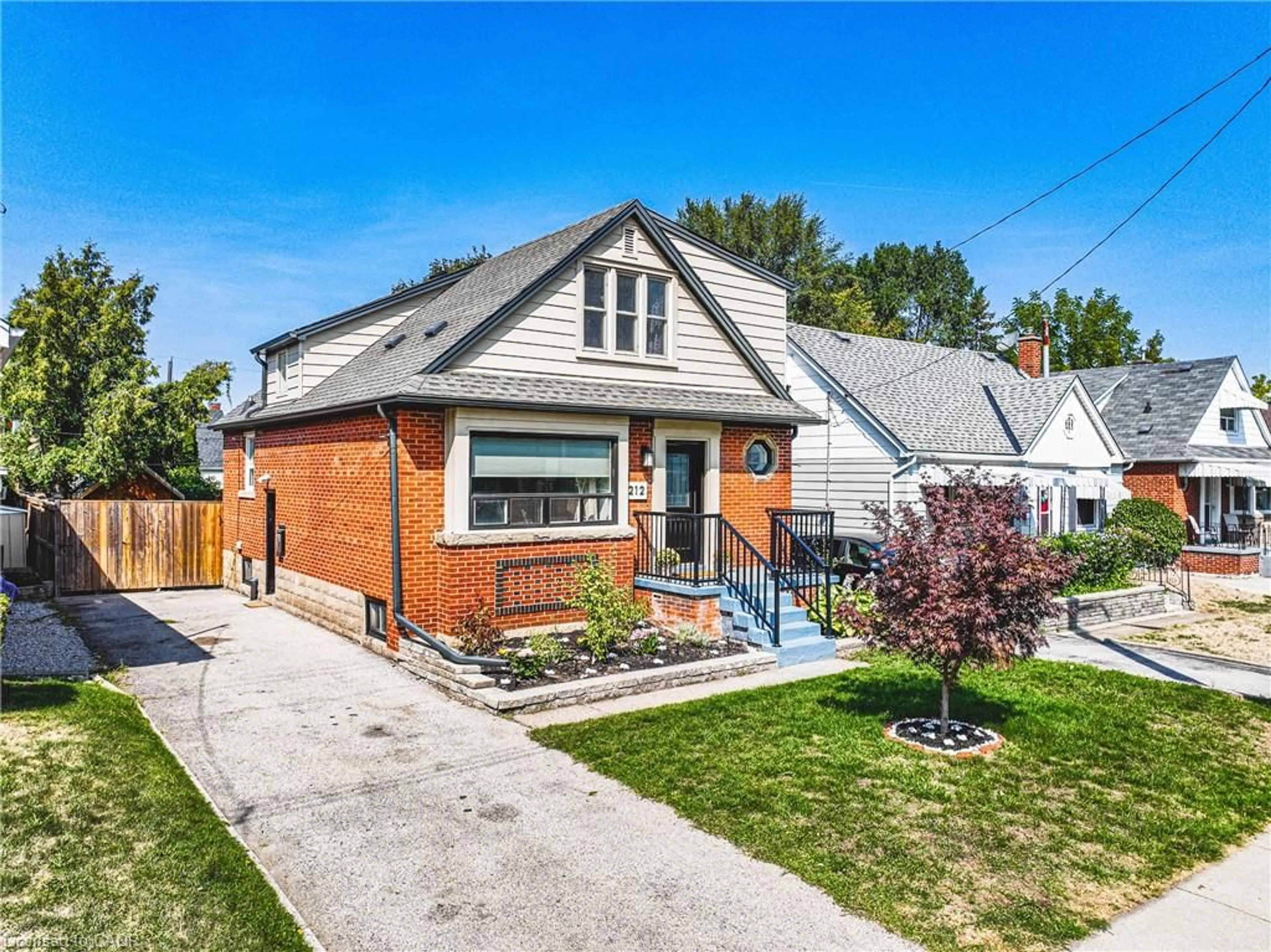 Home with brick exterior material, street for 212 Rodgers Rd, Hamilton Ontario L8K 3C4