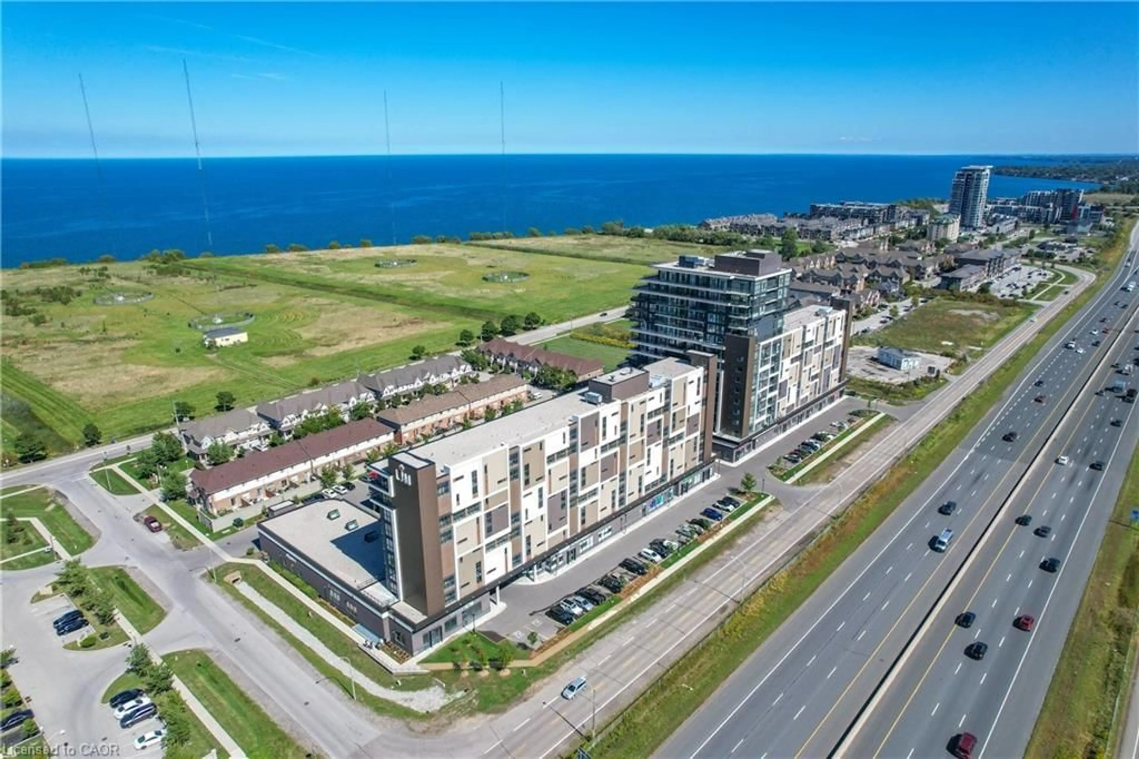 A pic from outside/outdoor area/front of a property/back of a property/a pic from drone, unknown for 560 North Service Rd #304, Grimsby Ontario L3M 4E8